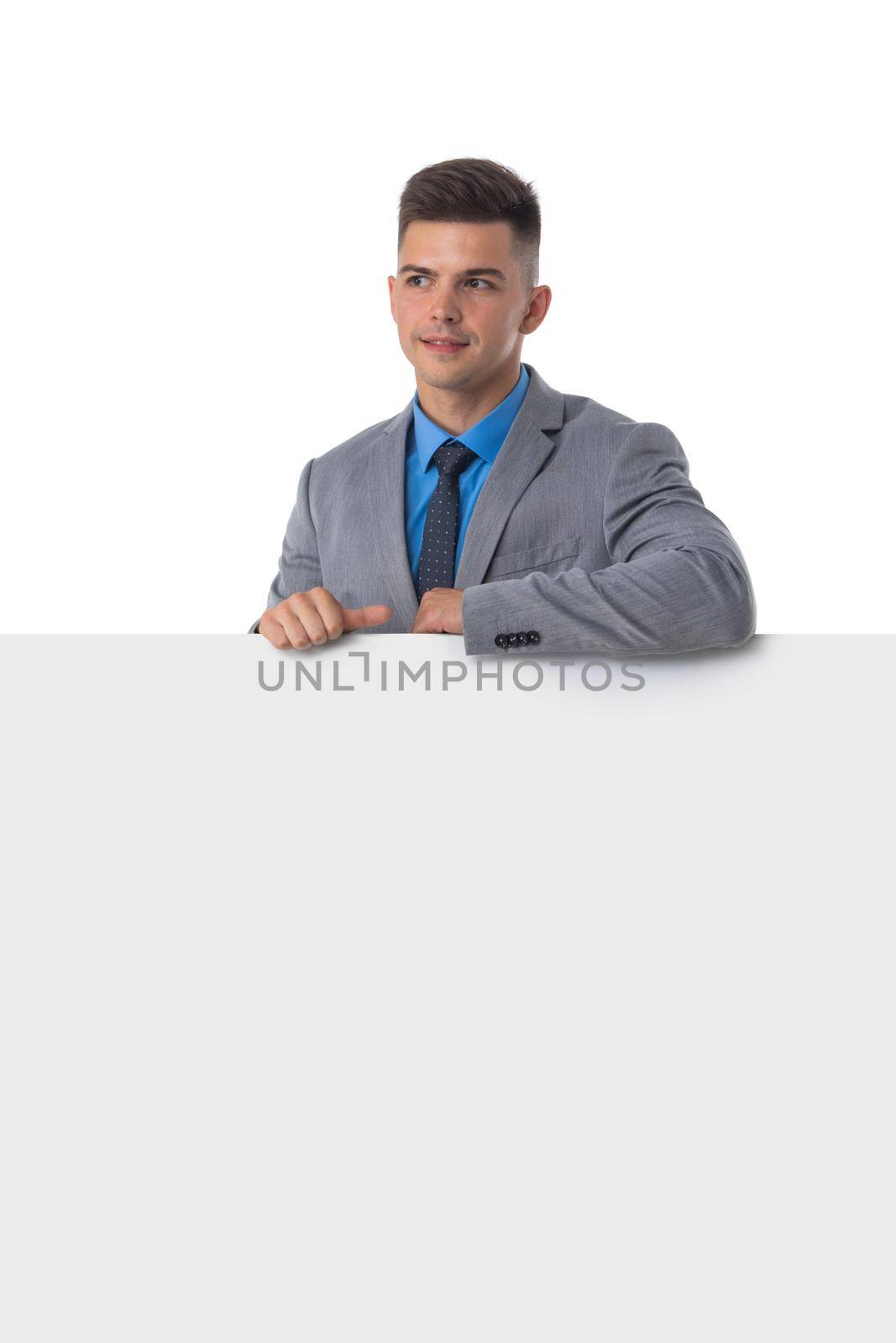 Businessman showing white banner by ALotOfPeople