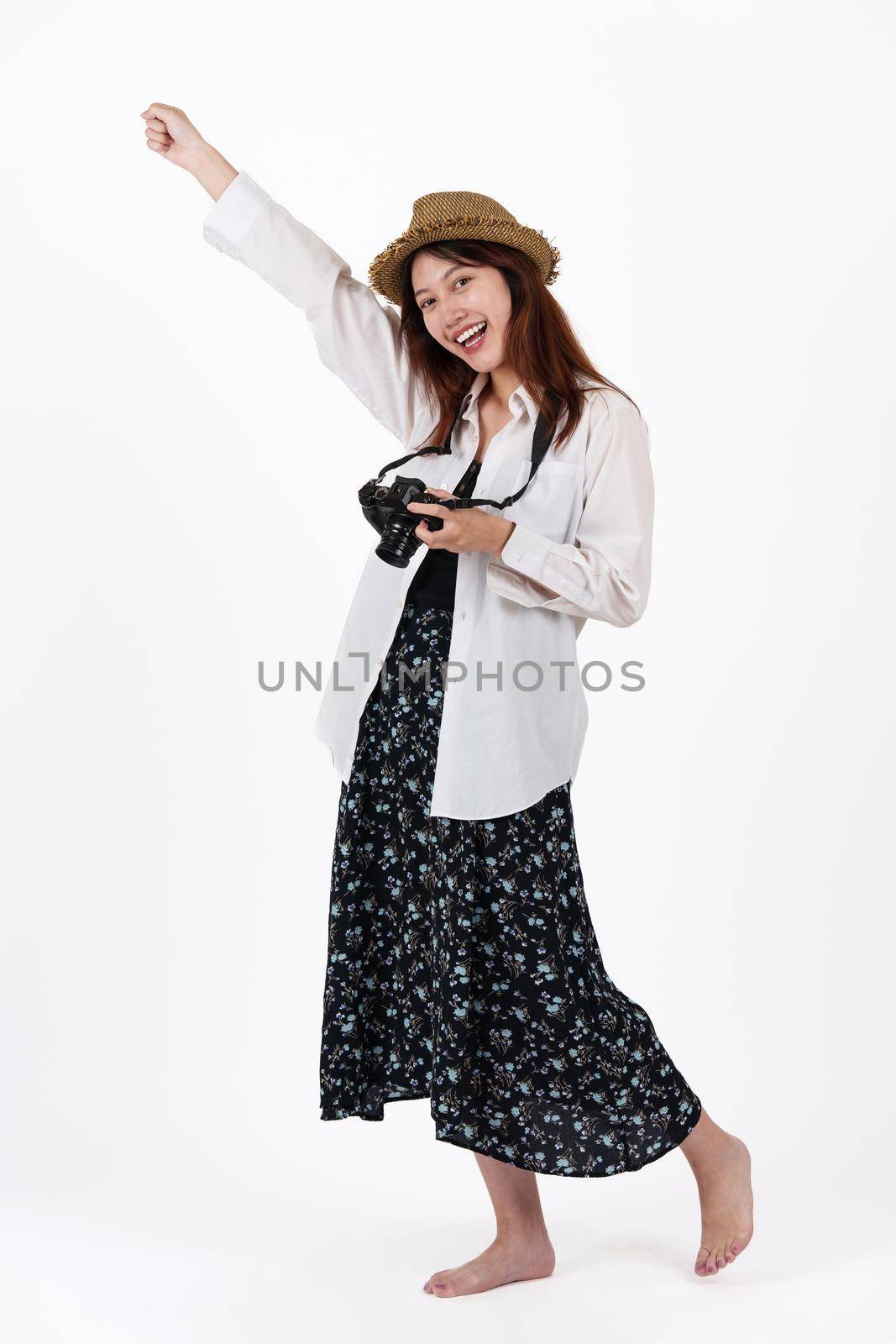 Image of happy young woman with camera isolate over white background. Travel concept