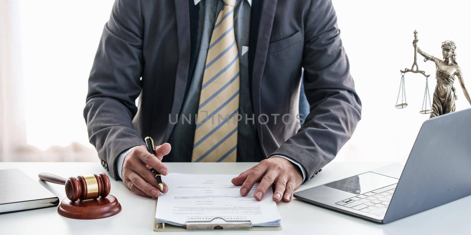 Close up lawyer businessman working or reading contract in office workplace for consultant lawyer concept. Law, legal services, advice, Justice concept