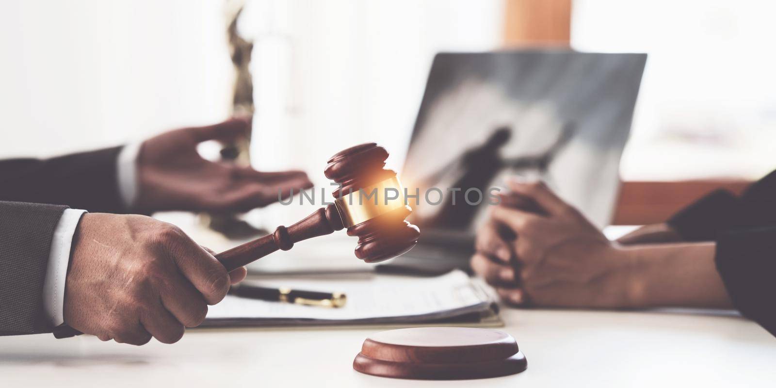 Business woman and lawyers discussing contract papers with brass scale on wooden desk in office. Law, legal services, advice, Justice concept