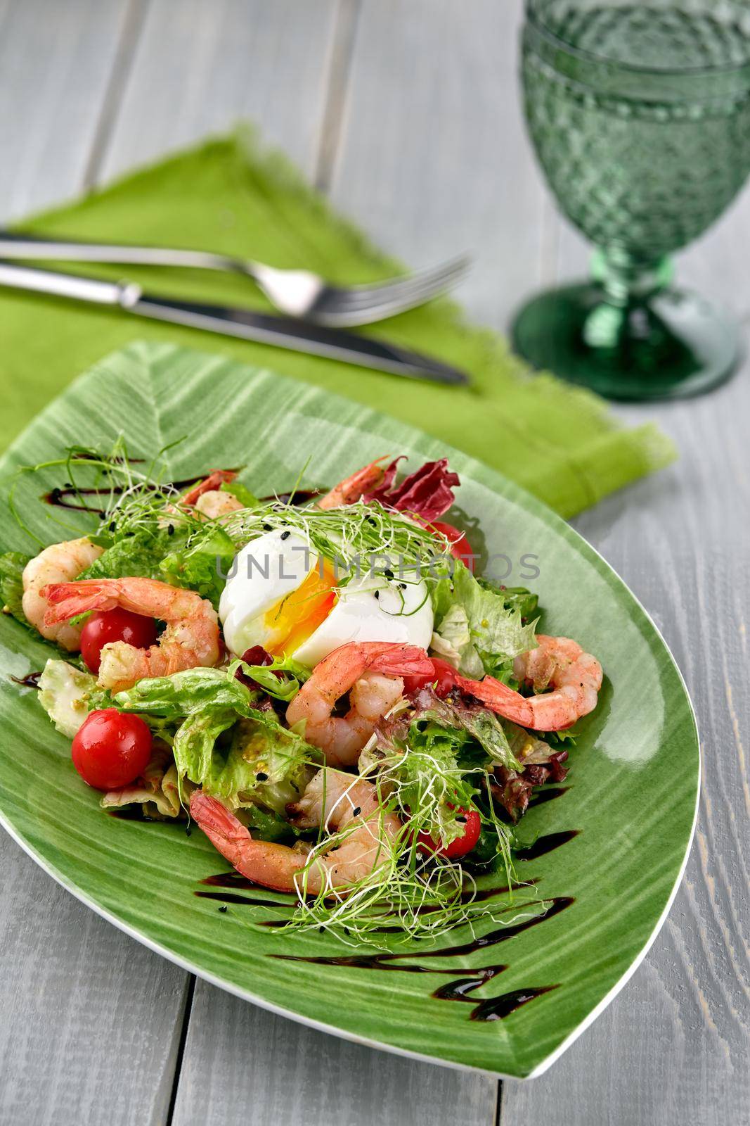 Salad from shrimp with lettuce, arugula, eggs, tomatoes, olive oil and balsamic vinegar. by nazarovsergey