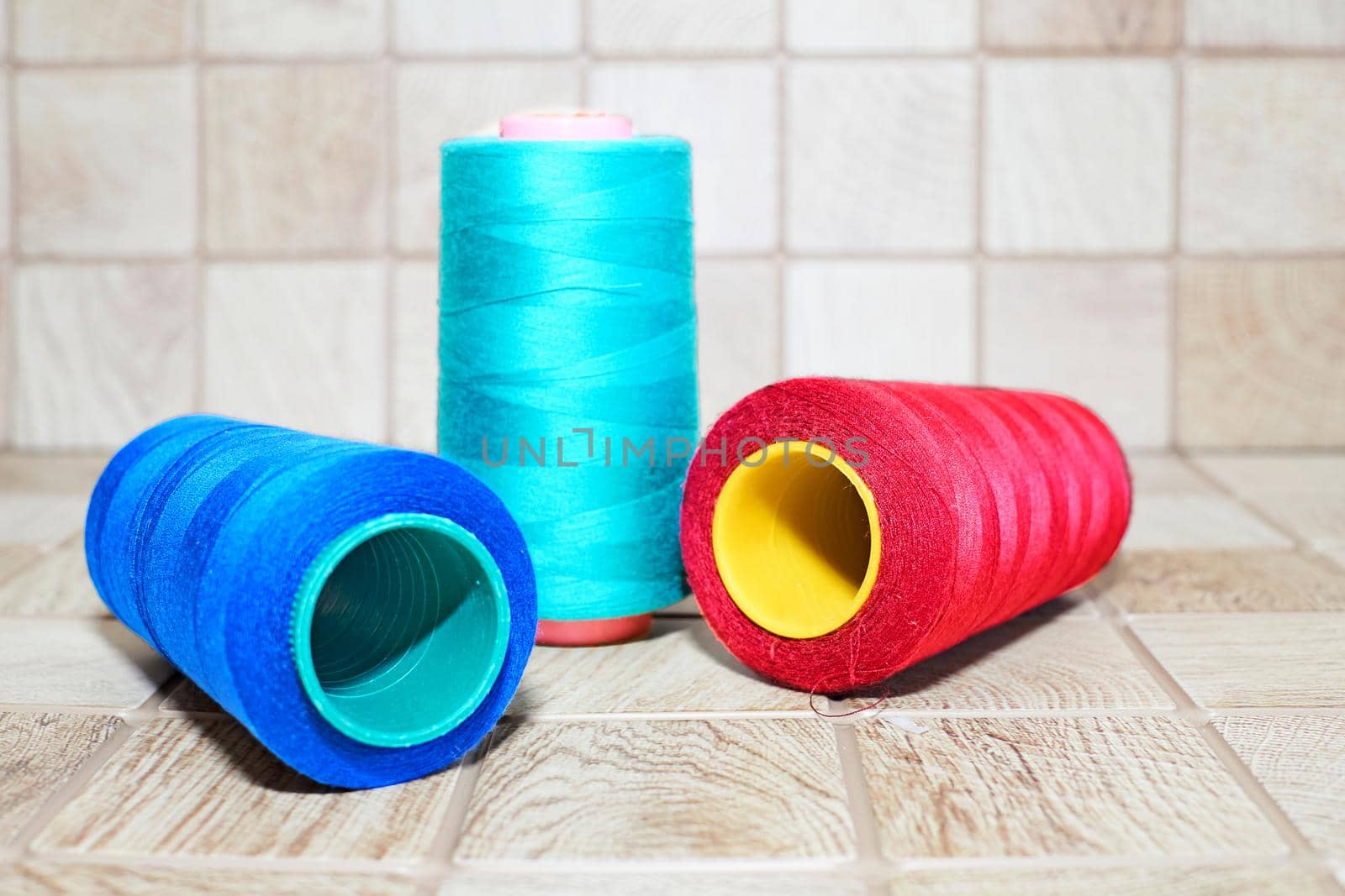 Three spools of thread. Navy, red and blue by jovani68