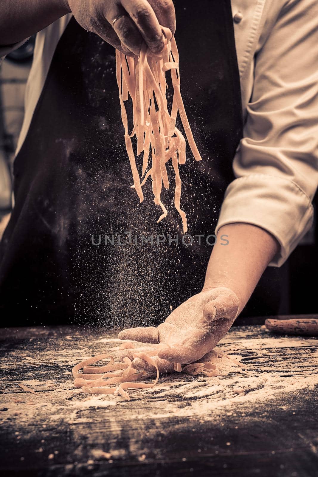 The chef makes fresh spaghetti from scratch. by nazarovsergey