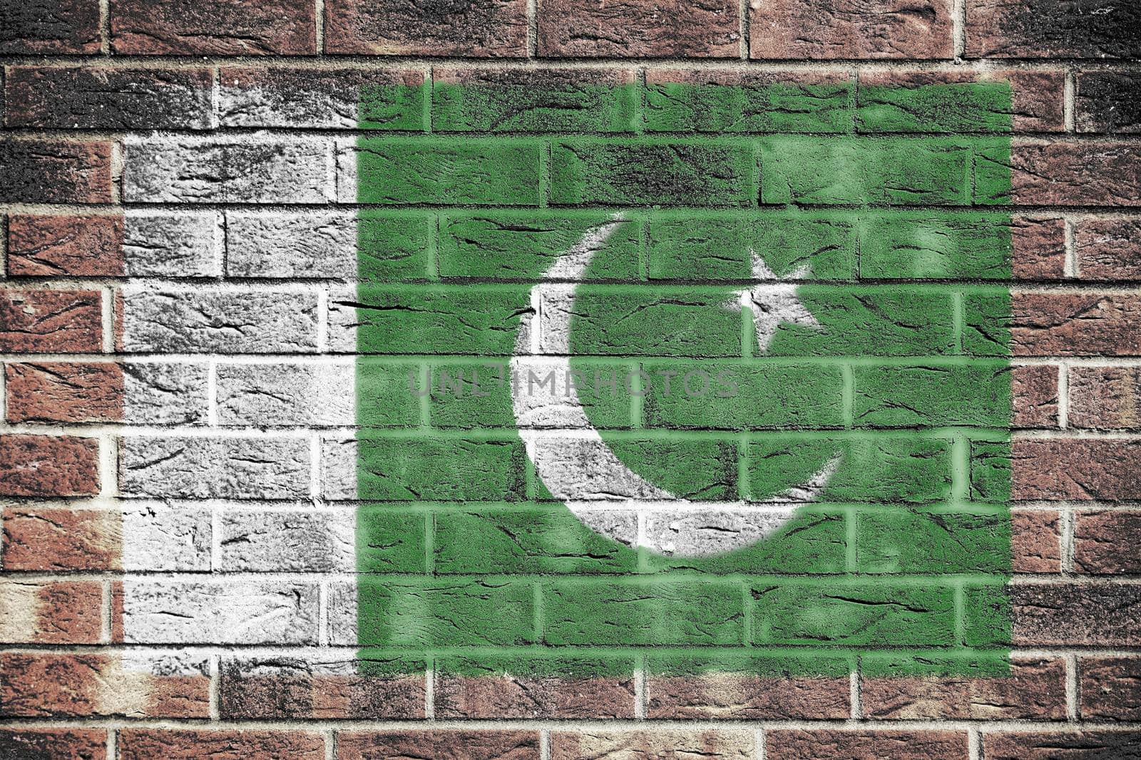 A Pakistan flag on old brick wall background