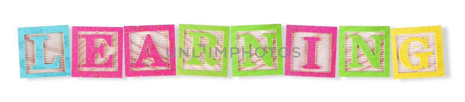 A learning concept with childs wood blocks on white with clipping path to remove shadow