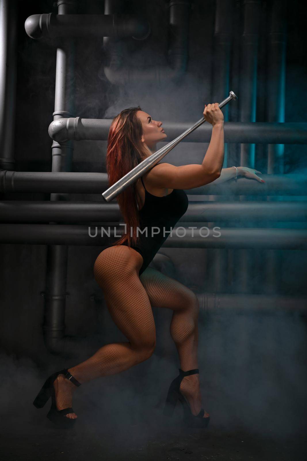 Red-haired girl in a black bodysuit sexy posing with a metal bat by but_photo