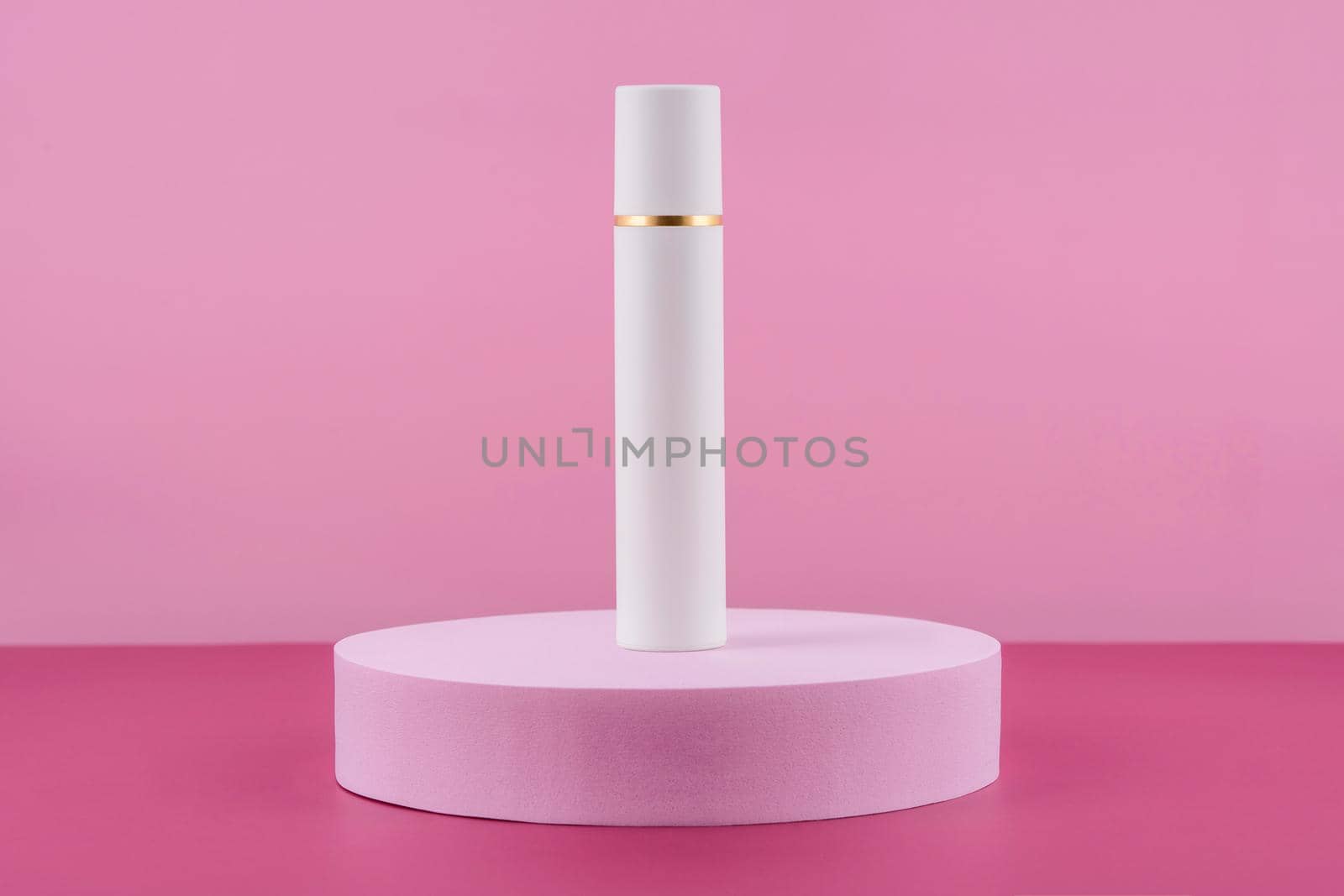 White pump cosmetic product on podium pedestal. Facial cream bottle on pink background, lotion in dispenser for woman skincare routine. Beauty moisturiser packaging. by photolime