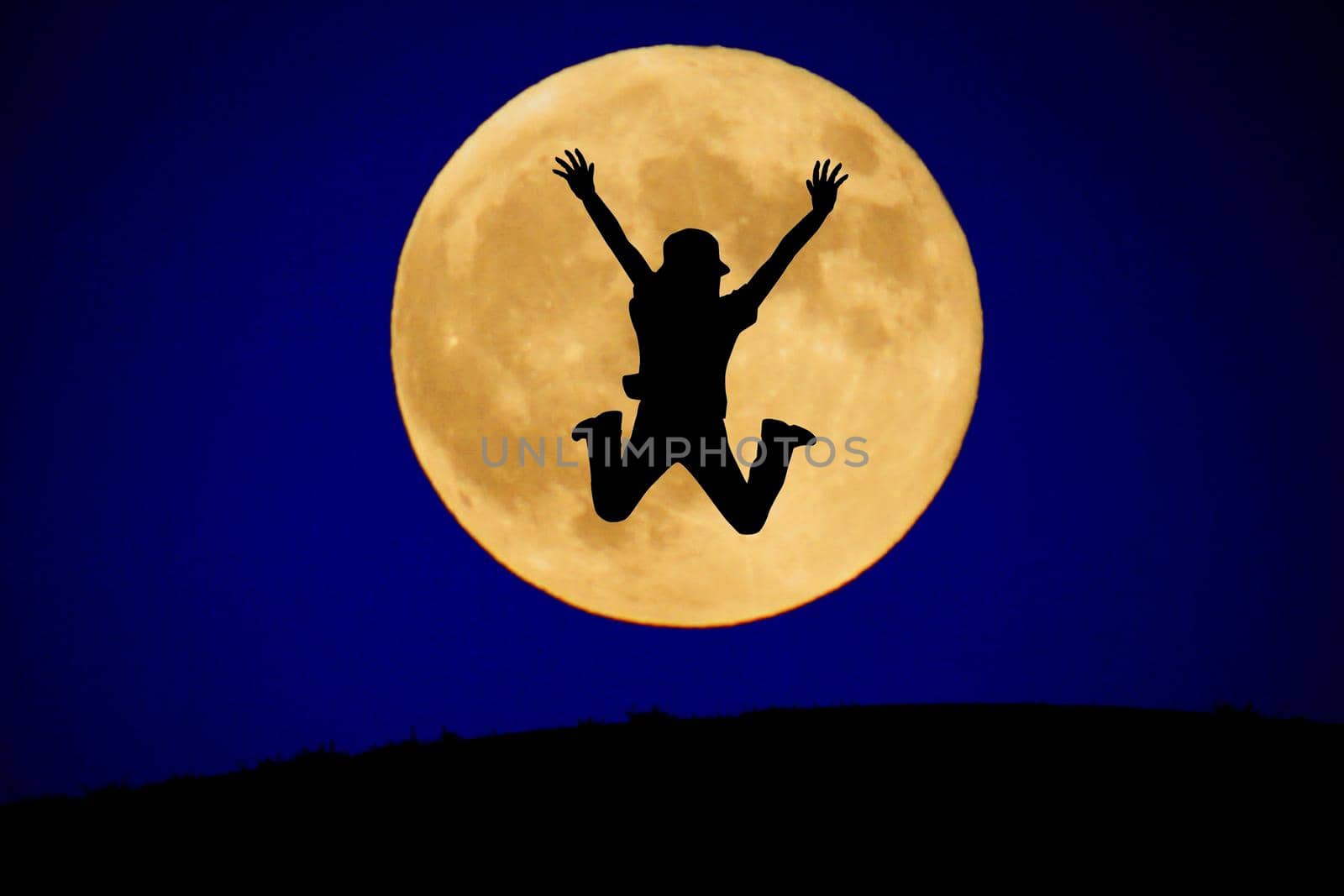 A young man jumping to the moon. Shooting Location: Tokyo metropolitan area