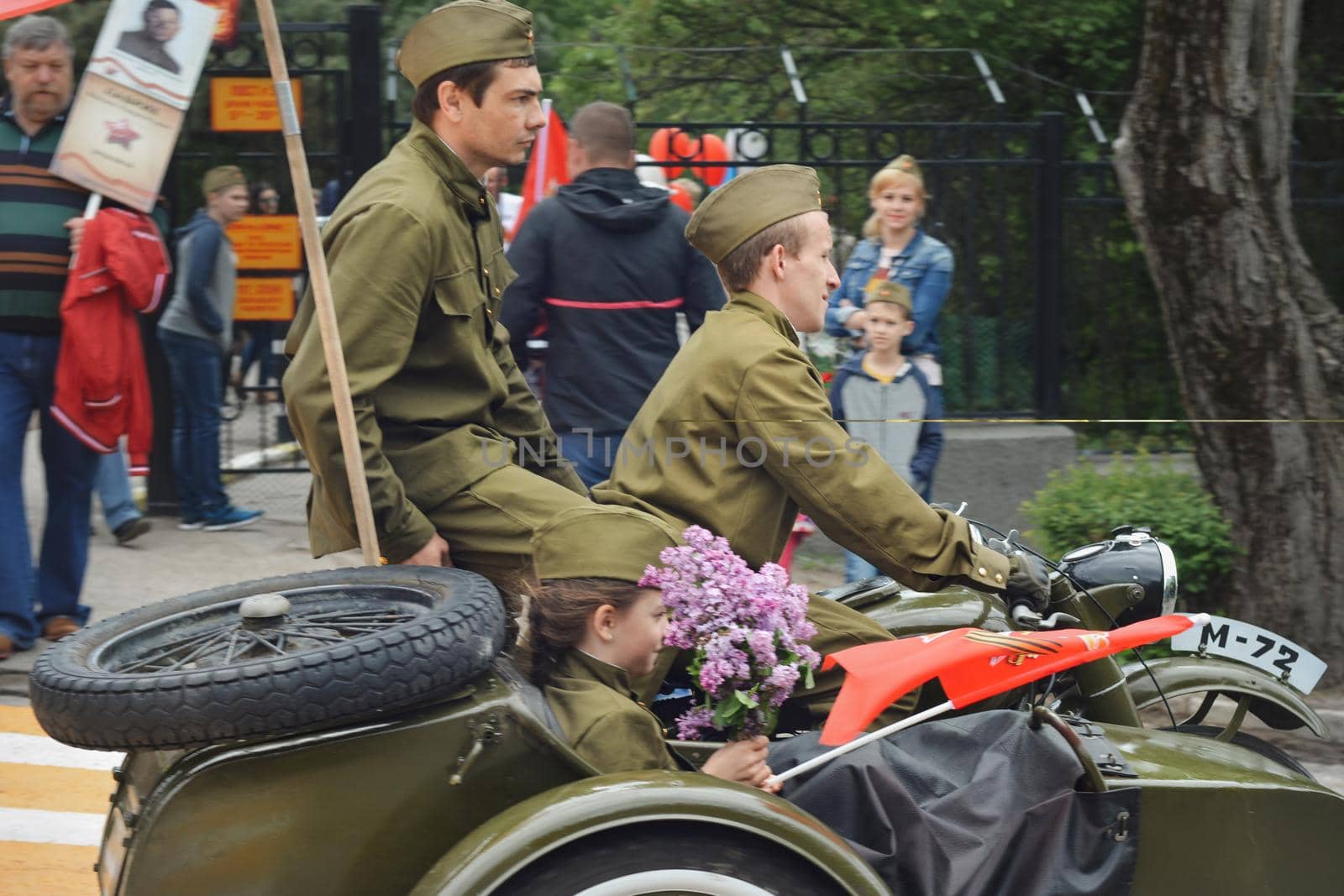PYATIGORSK, RUSSIA - MAY 09, 2017: Men in uniform on a motorcycle M-72 with a cradle . The Victory Day celebration