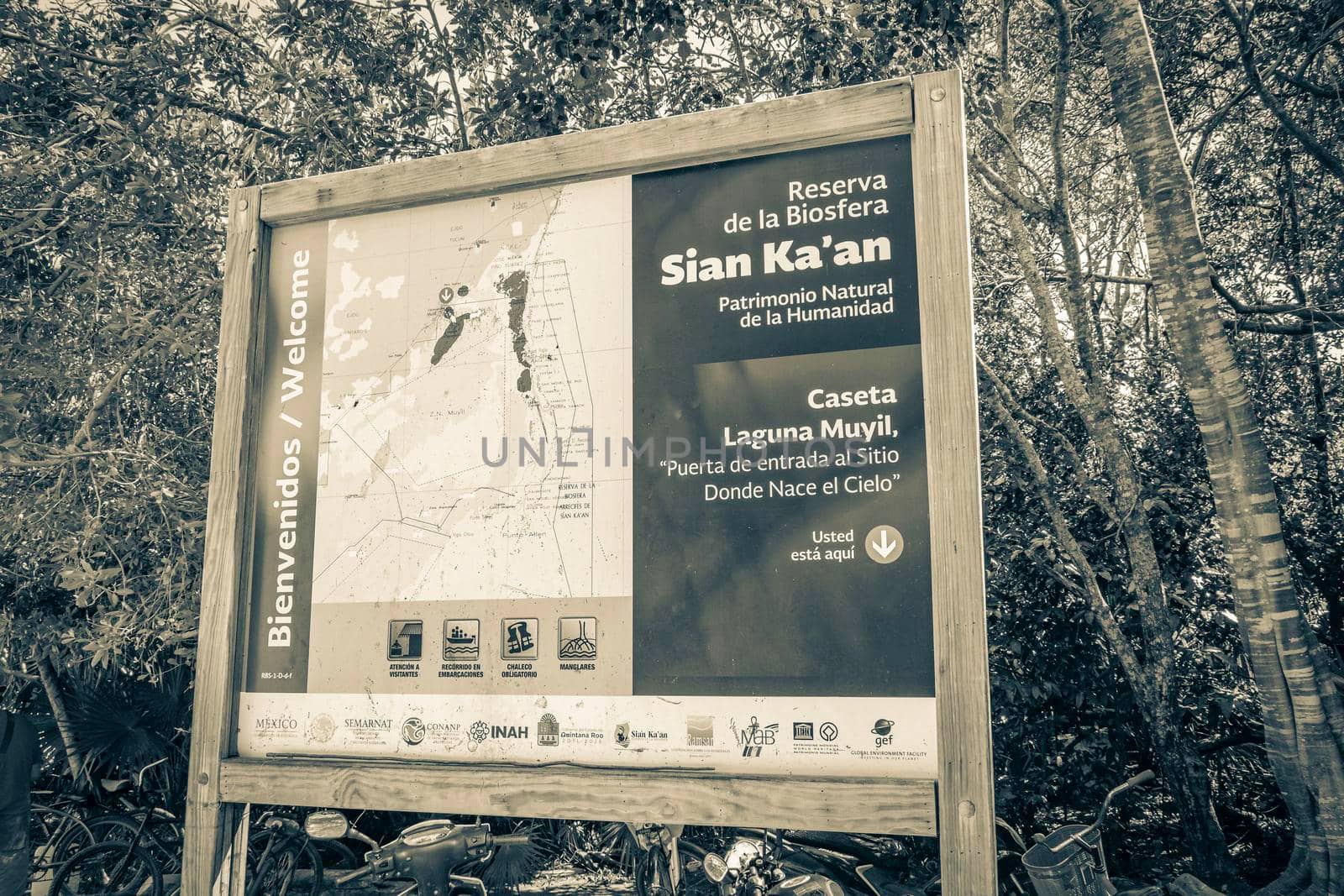 Muyil Mexico 02. February 2022 Old black and white picture of an information entrance walking trails and welcome sing board to the Sian Ka'an National Park in Muyil Chunyaxche Quintana Roo Mexico.