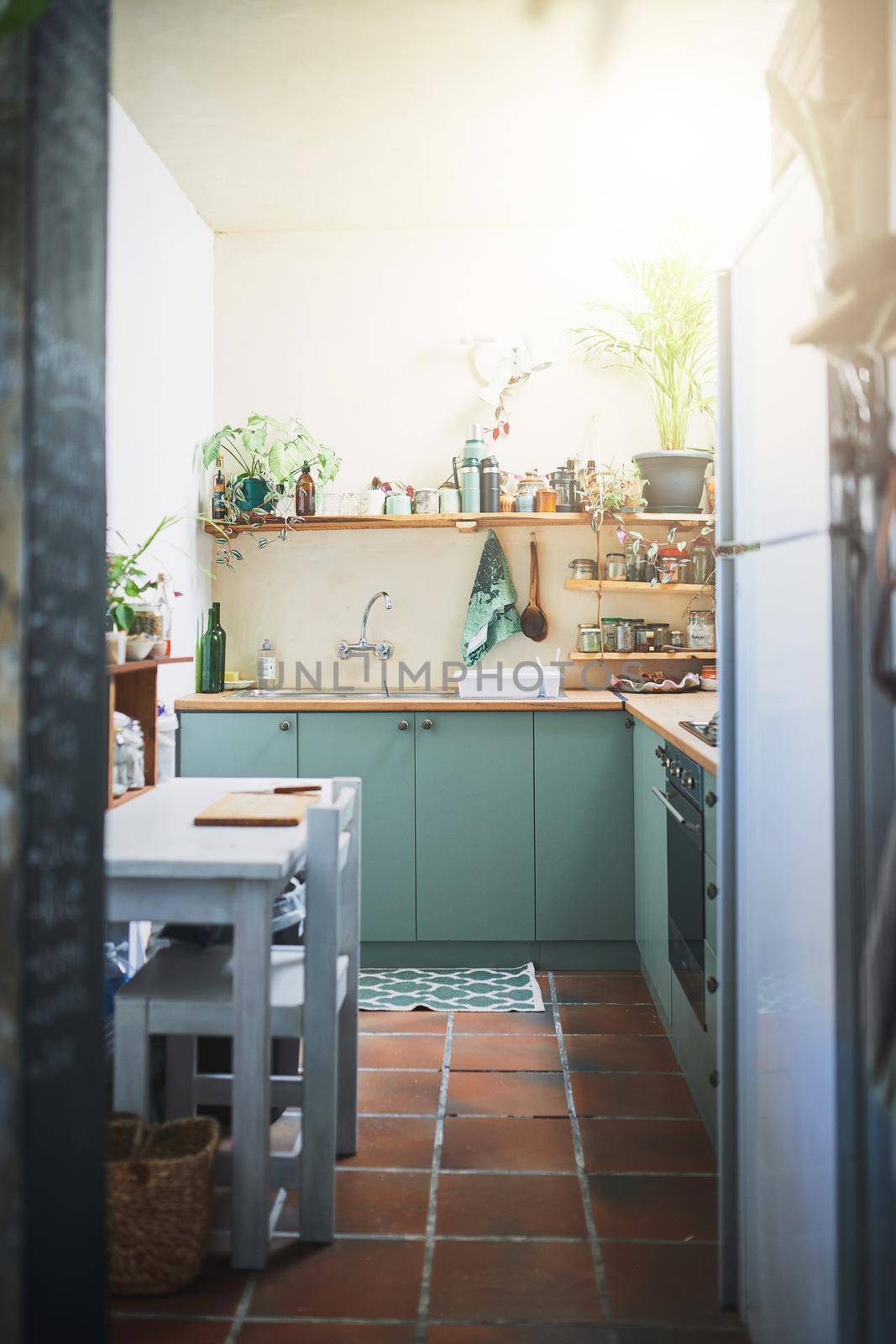 Vertical shot of an beautiful homey apartment kitchen