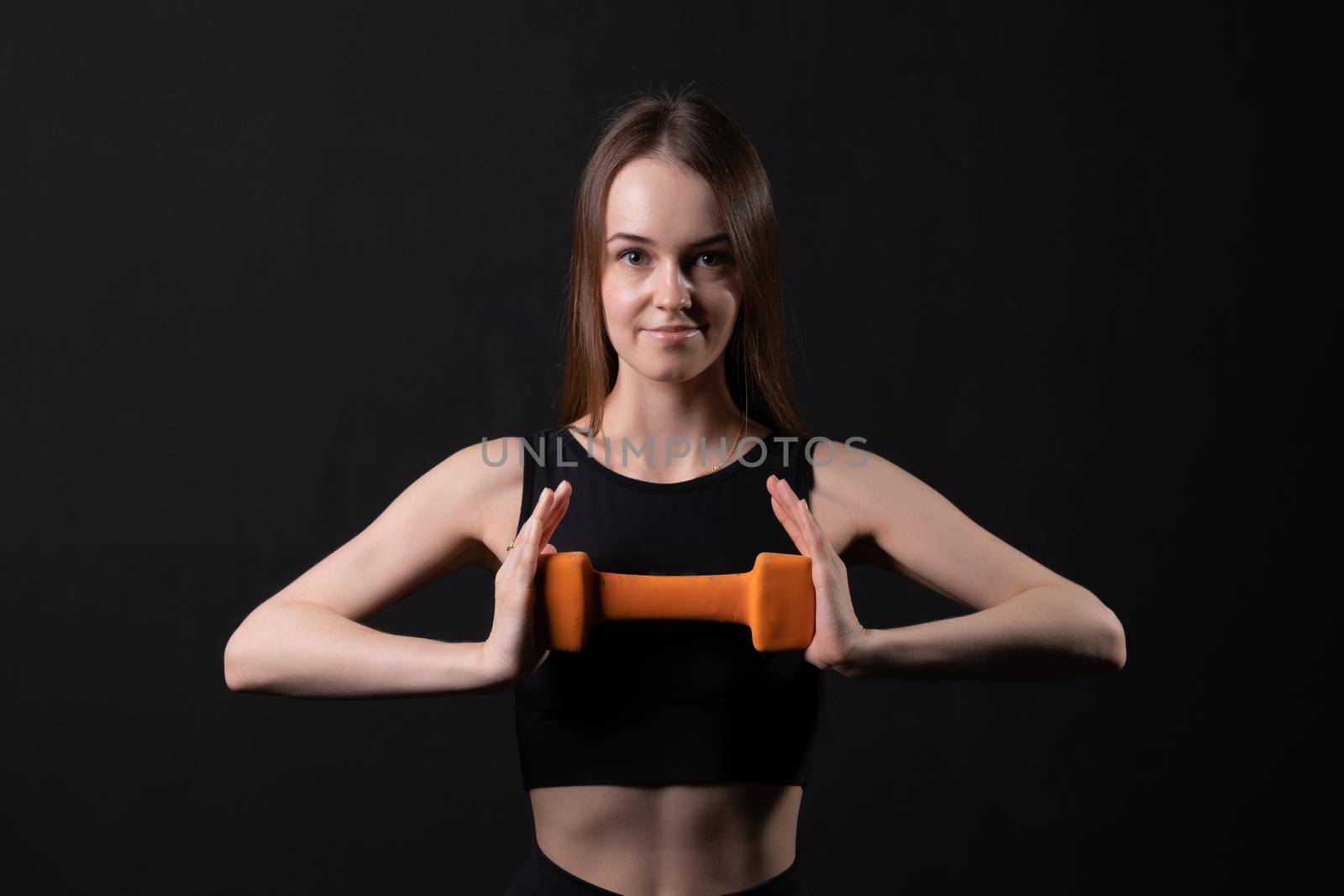 Background a dumbbells maiden beautiful black with orange . On orange two white, from health body in lifestyle from sport care, happy loss. Fat big adult, obesity young overweight doing by 89167702191