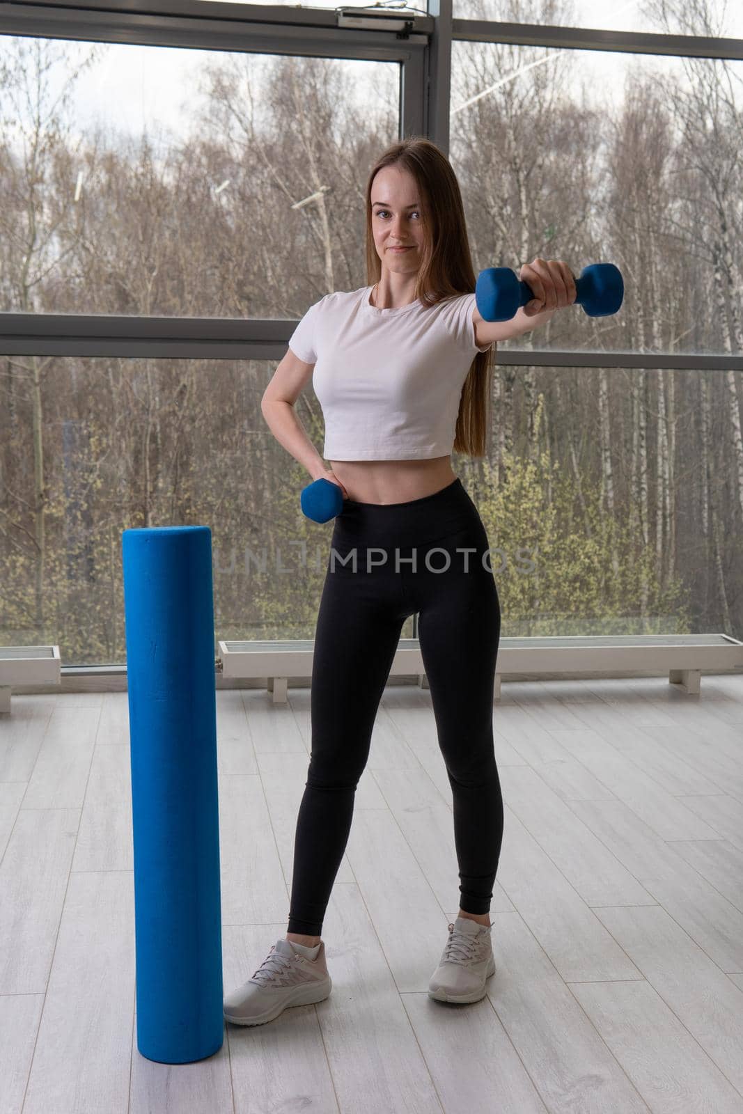 Roller and training dumbbells skate a Girl with foam roller mfr gym, for girl fitness from body for strong active, people pilates. Pink resistance motivation, relaxation by 89167702191