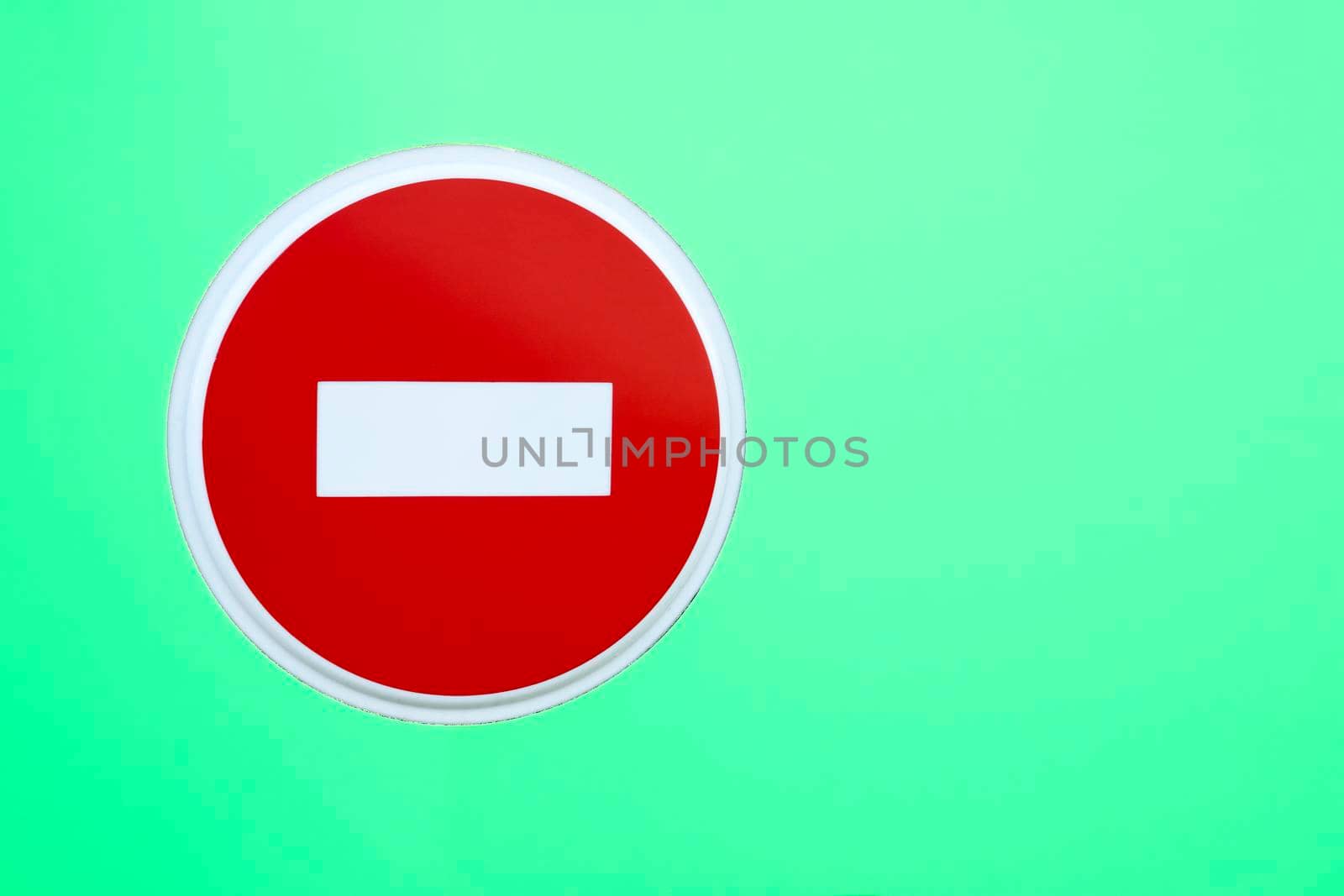 Stop road sign on green isolated background by jovani68