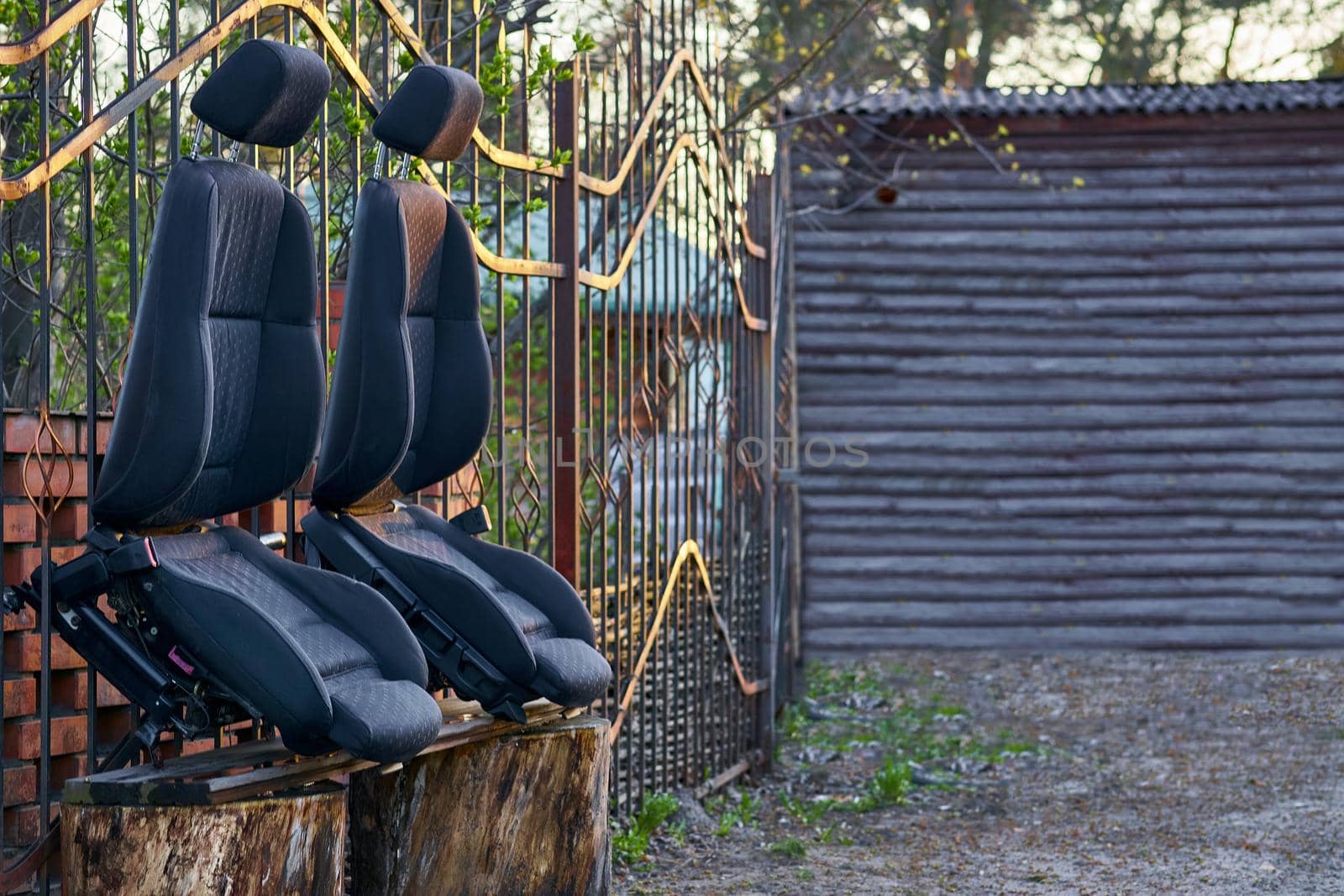 Two car seats drying in the sun after dry cleaning and place for text by jovani68