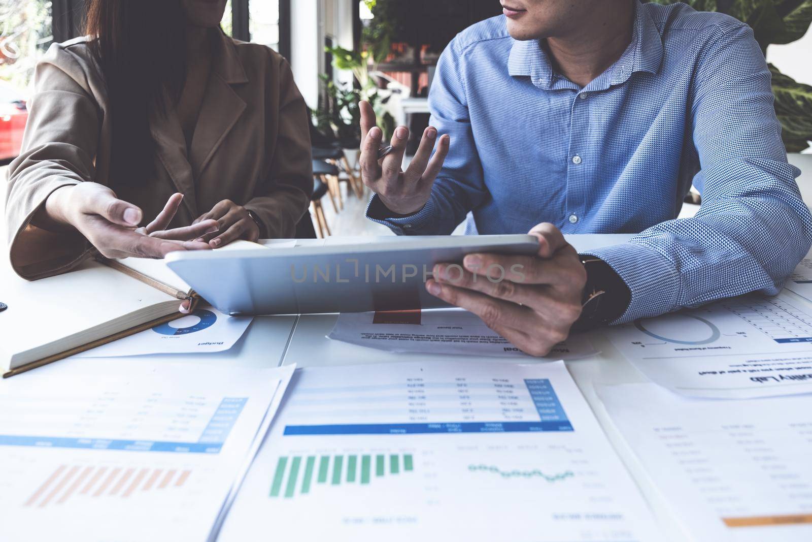 Fund managers team consultation and discuss about analysis Investment stock market by digital tablet