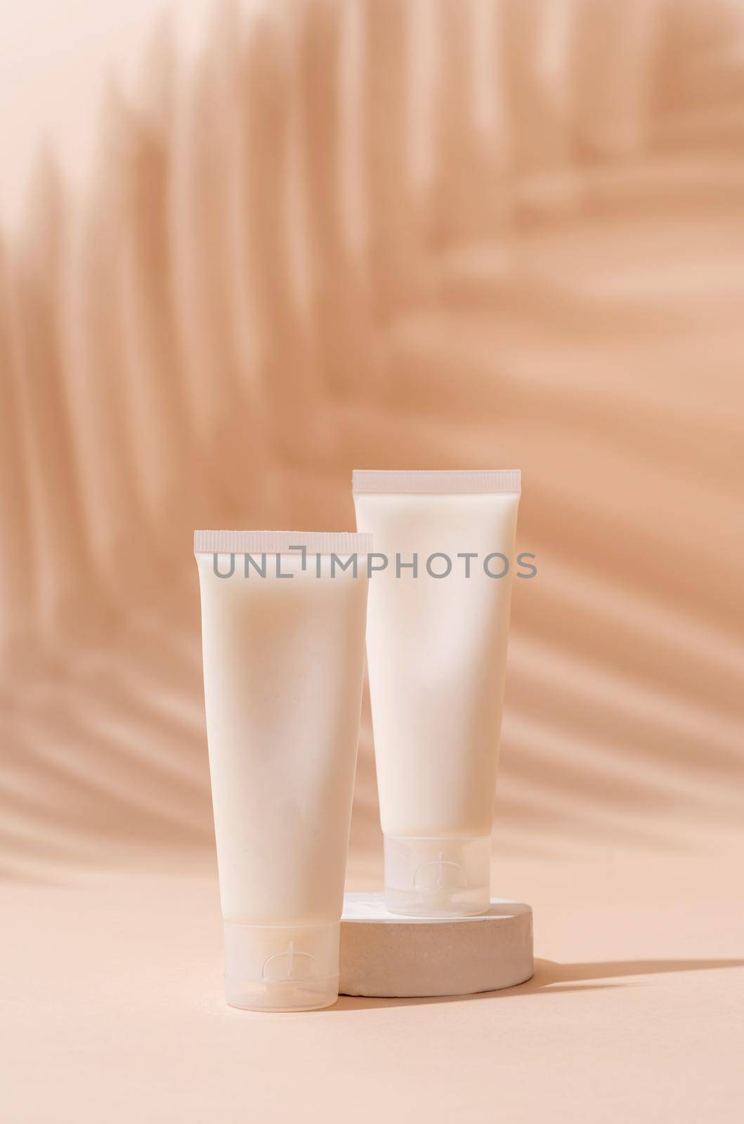 Cream tube mockup for branding presentation. Natural skincare beauty product on square white podium. Natural earthy colors, beige background