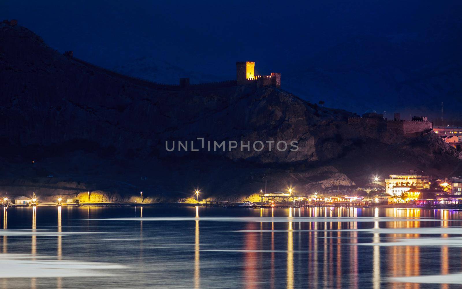 Night view on Genoese Fortress from sea side in Sudak, Crimea