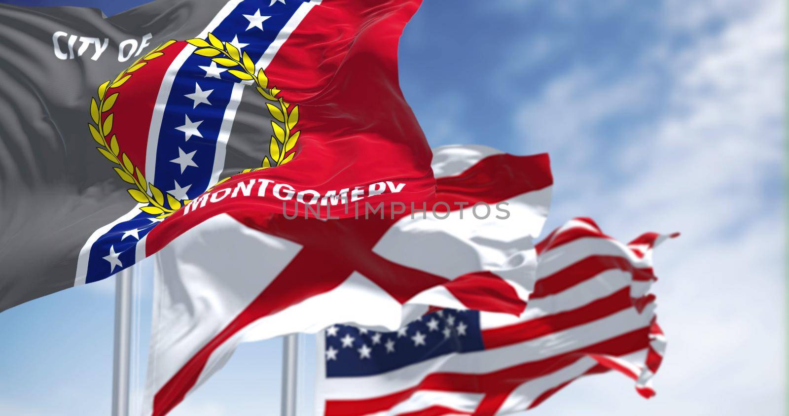 The flags of the Alabama state and United States of America waving in the wind. by rarrarorro