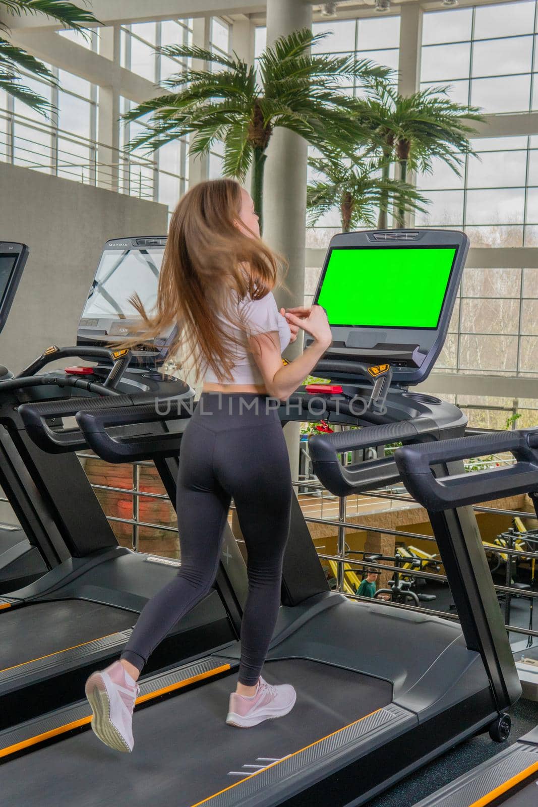 Indoors young length woman treadmill profile full running female, from workout healthy for athlete for training cardio, muscles together. Jogging legs slim, green screen