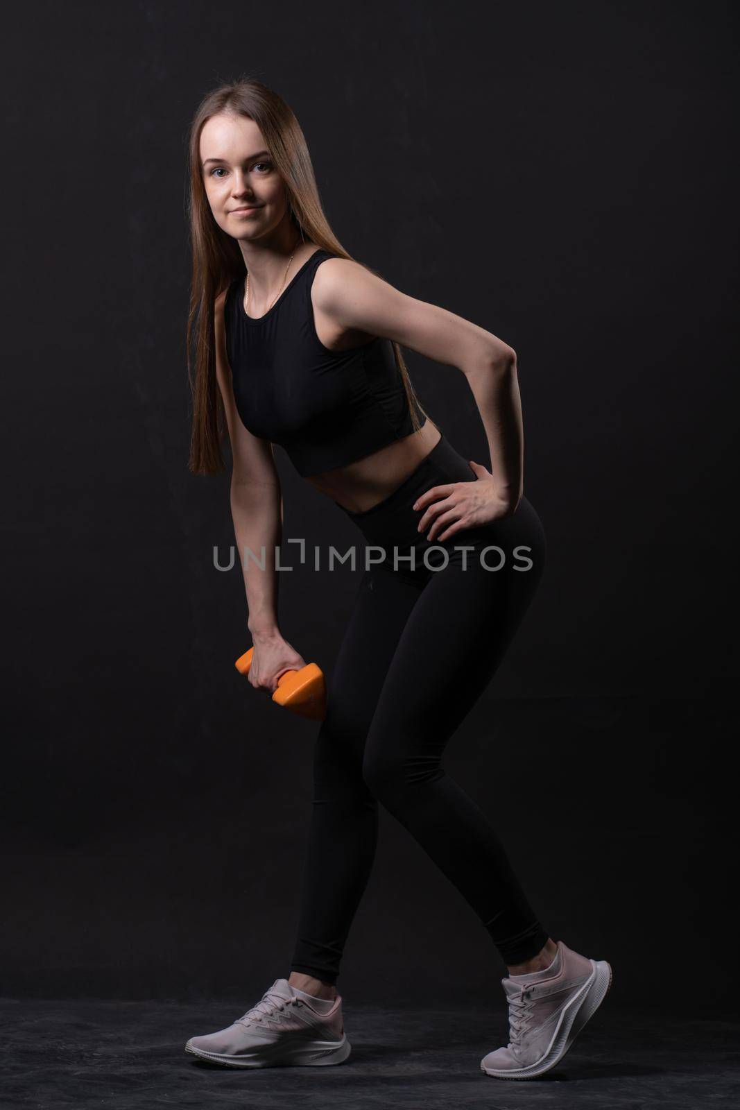 With . A black dumbbells background on beautiful maiden orange orange isolated gym, for shape body for fit from weight diet, happy plus. Chubby big adult, figure young overweight doing