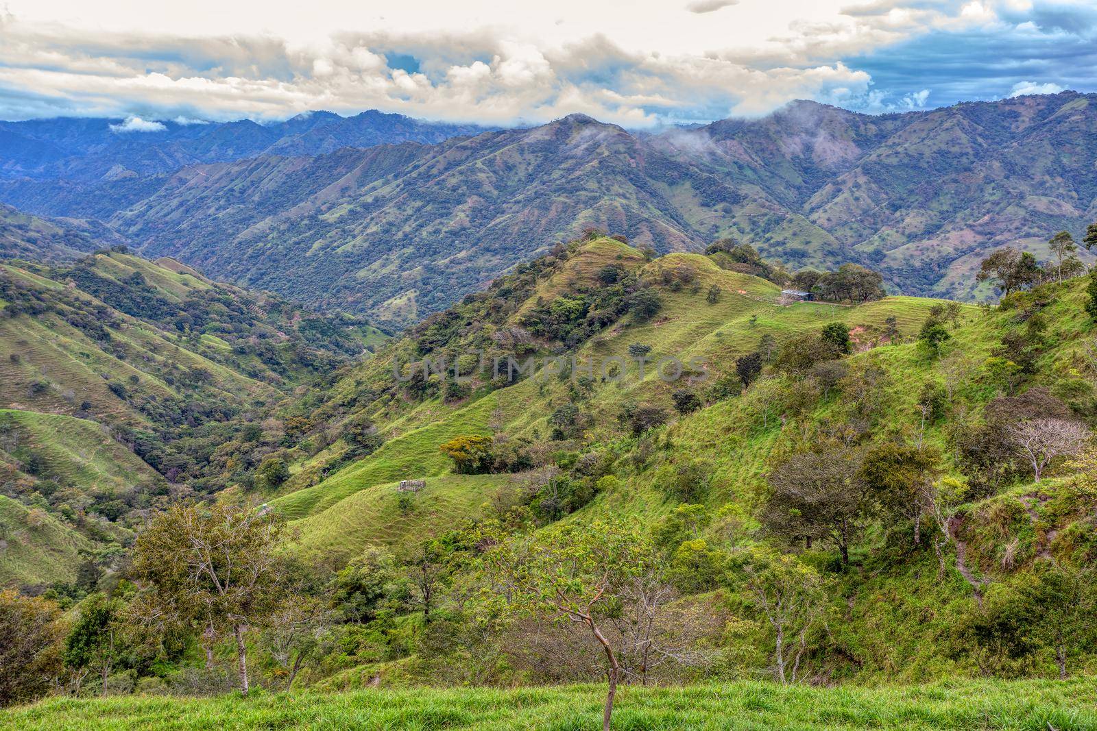 Beautiful view on the hills and forest surrounding Los Quetzales national park, beautiful Costa Rica Wilderness landscape