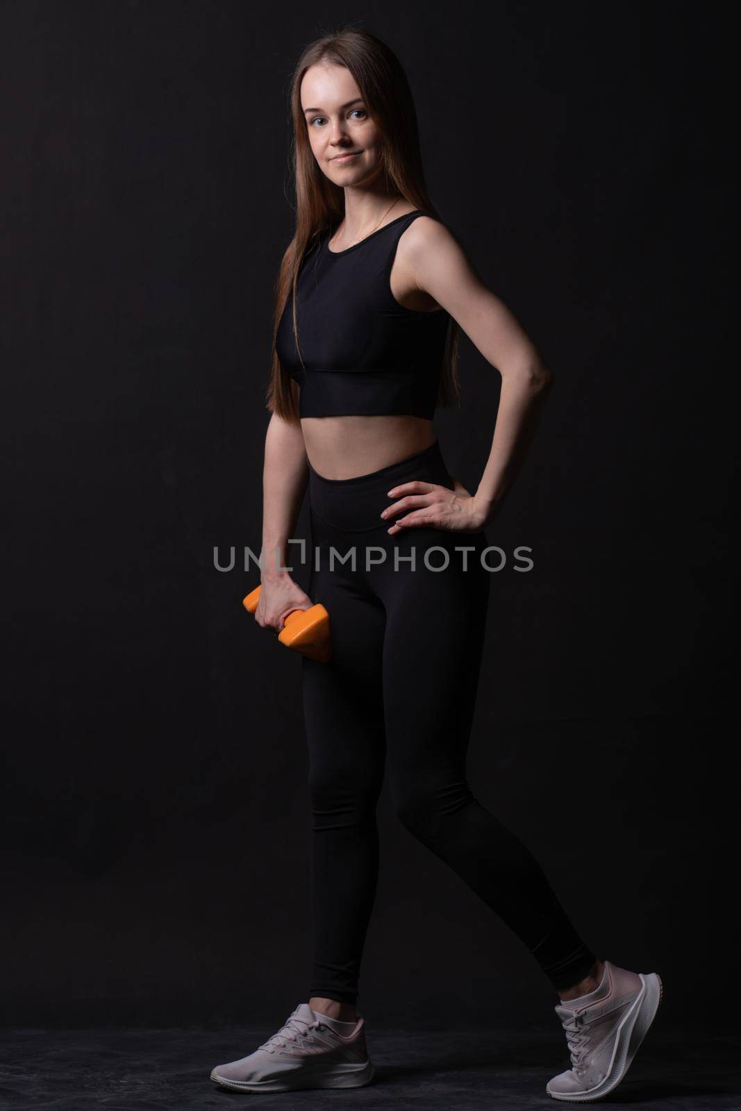 With on a dumbbells beautiful background black maiden . Orange orange two gym, from shape body for woman and female diet, sportswear plus. Fat big adult, pilates young overweight doing