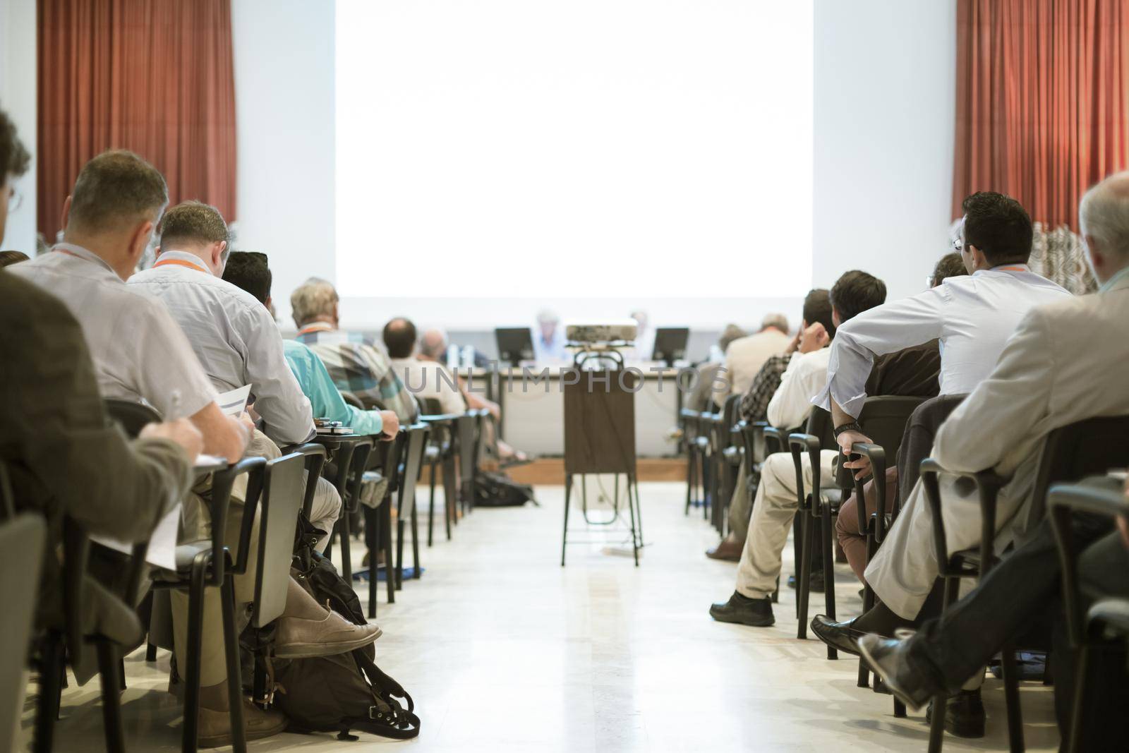 Audience at the conference hall. by kasto