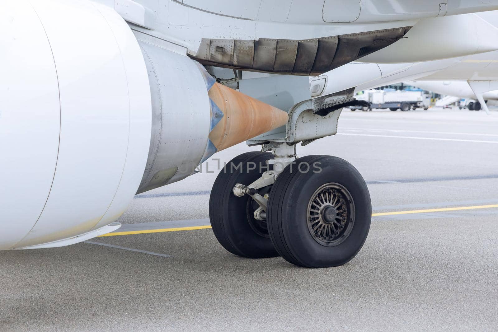 Close-up of wheel of big passenger airplane for airport