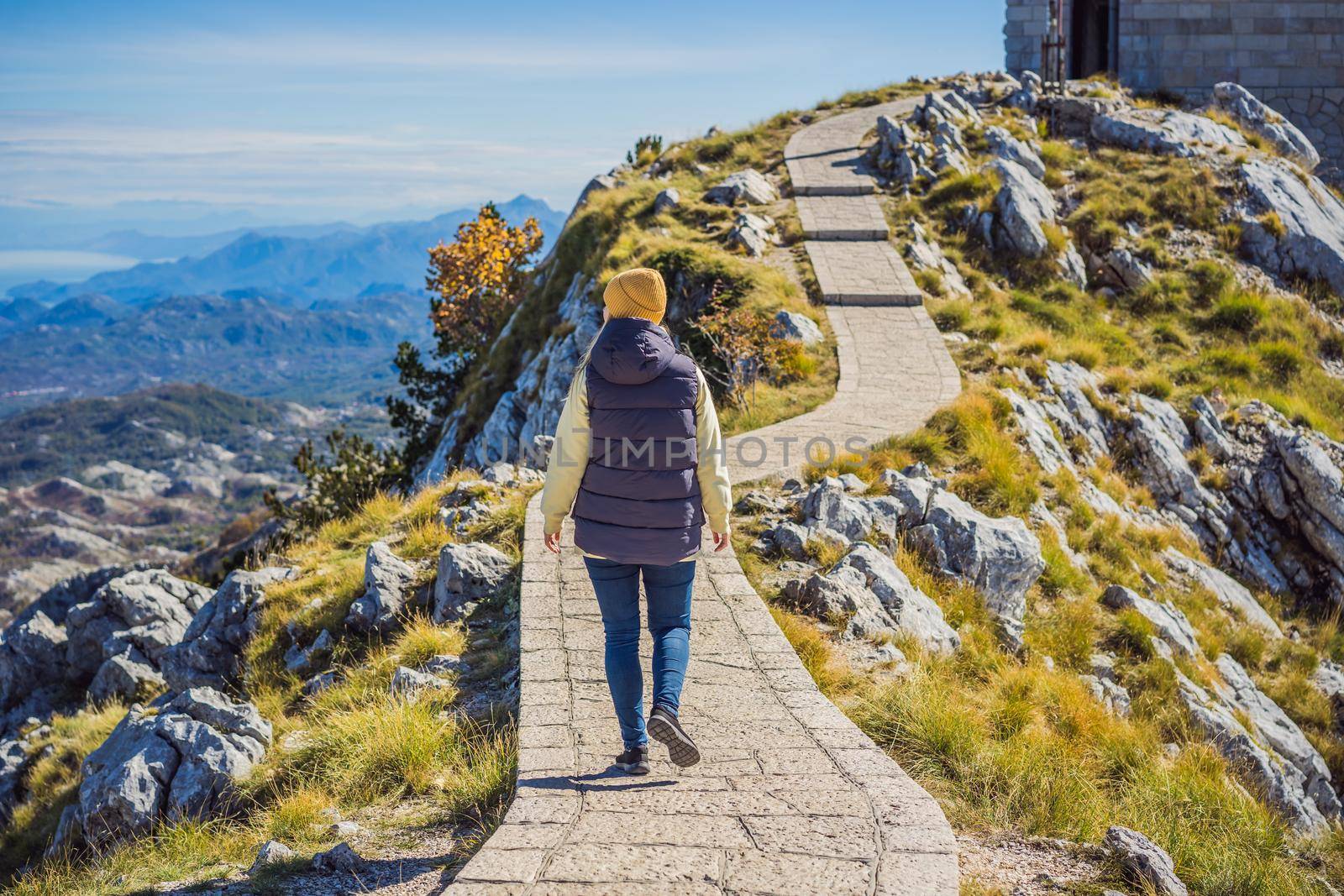 Woman traveller in mountain landscape at national park Lovcen, Montenegro. Travel to Montenegro concept by galitskaya