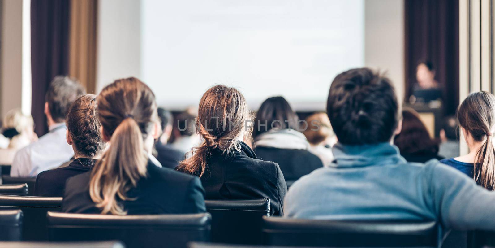 Audience in the lecture hall. by kasto