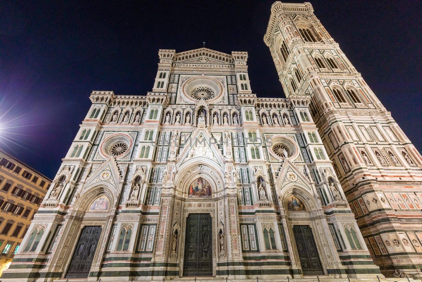 Florence, Italy - Circa August 2021: Florence by night. The  illuminated architecture of the famous cathedral exterior.