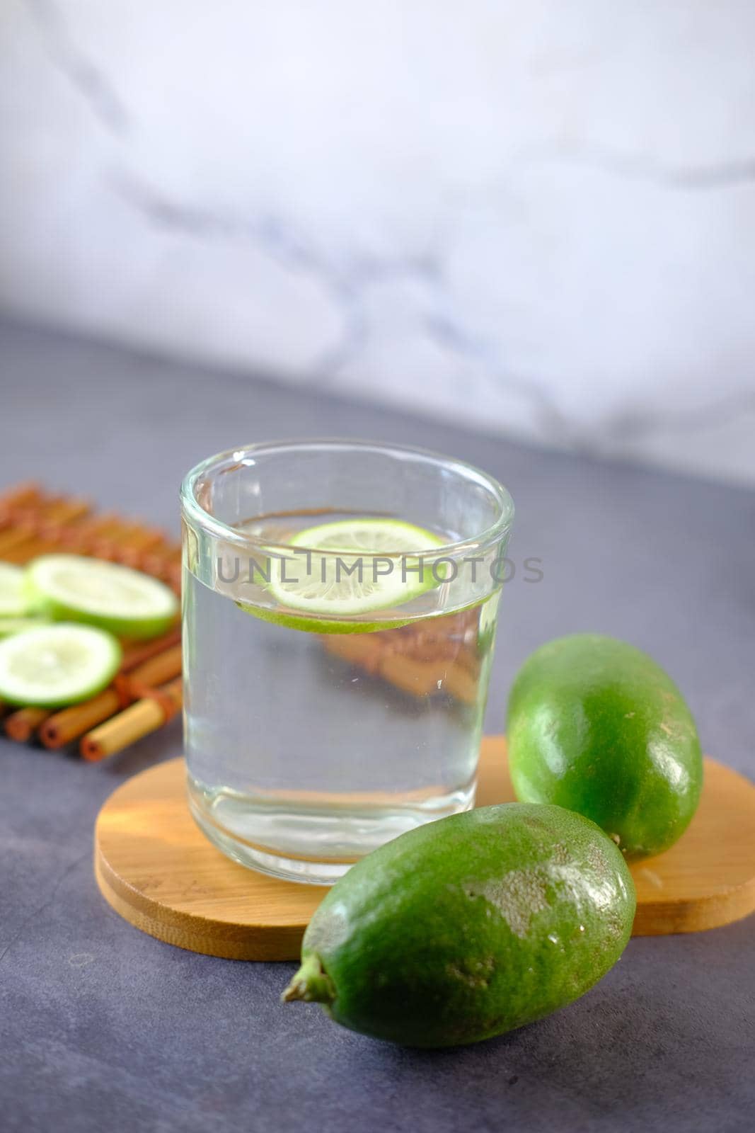 Refreshing lemon water drink on table , top view .