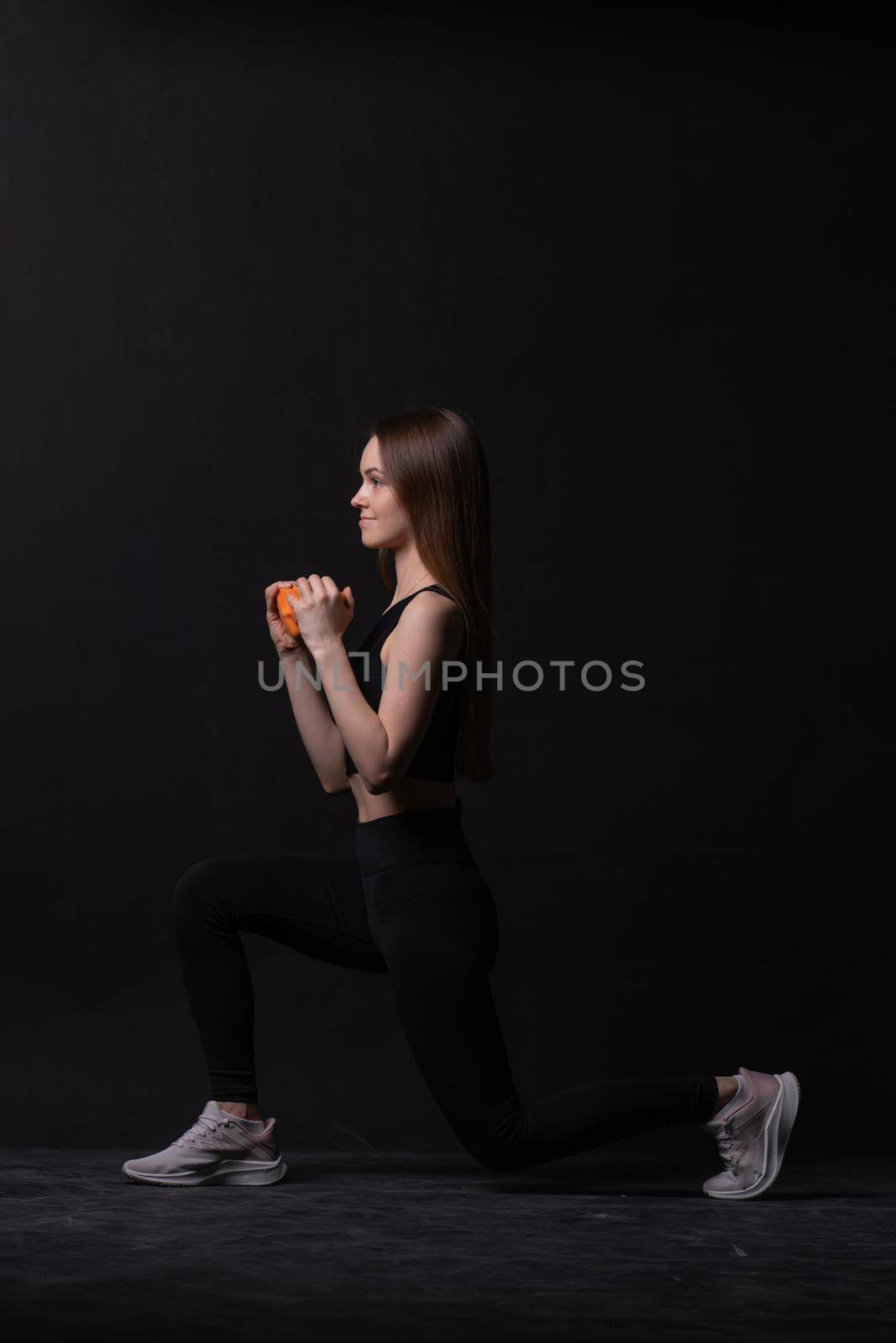 Orange background black . Dumbbells maiden beautiful on a with orange two gym, for health body for person and weight diet, sportswear plus. Chubby big joy, figure young overweight doing