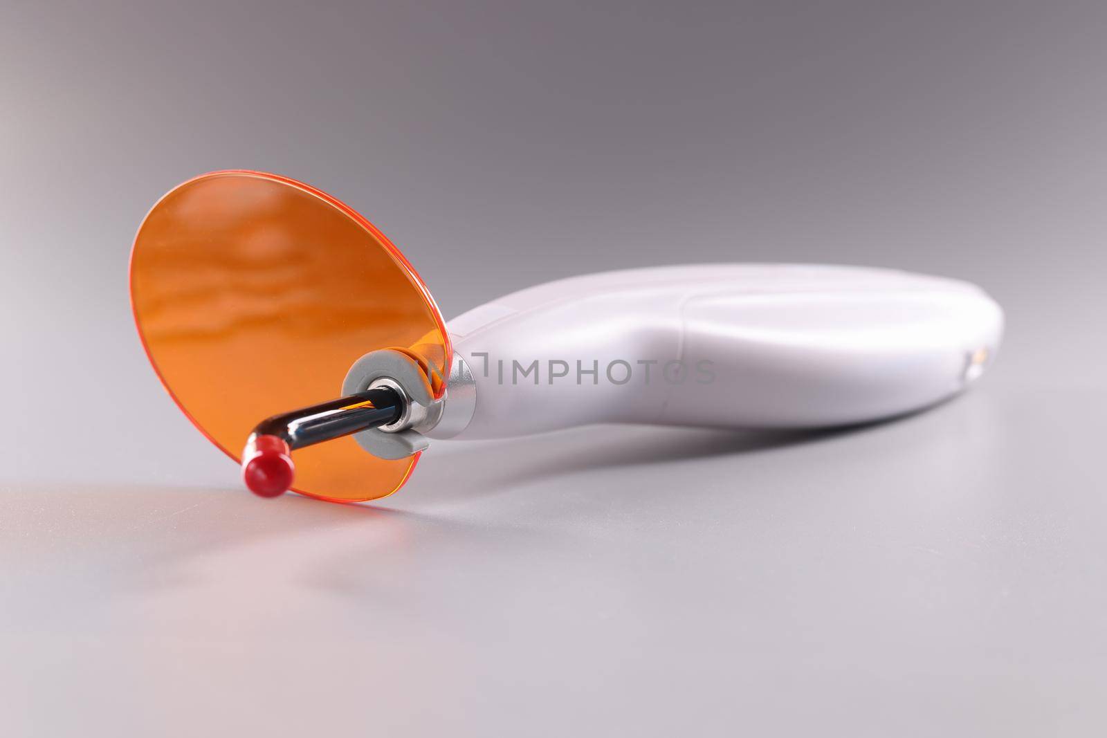 Polymerizer, electrical stomatological tool with orange protective by kuprevich