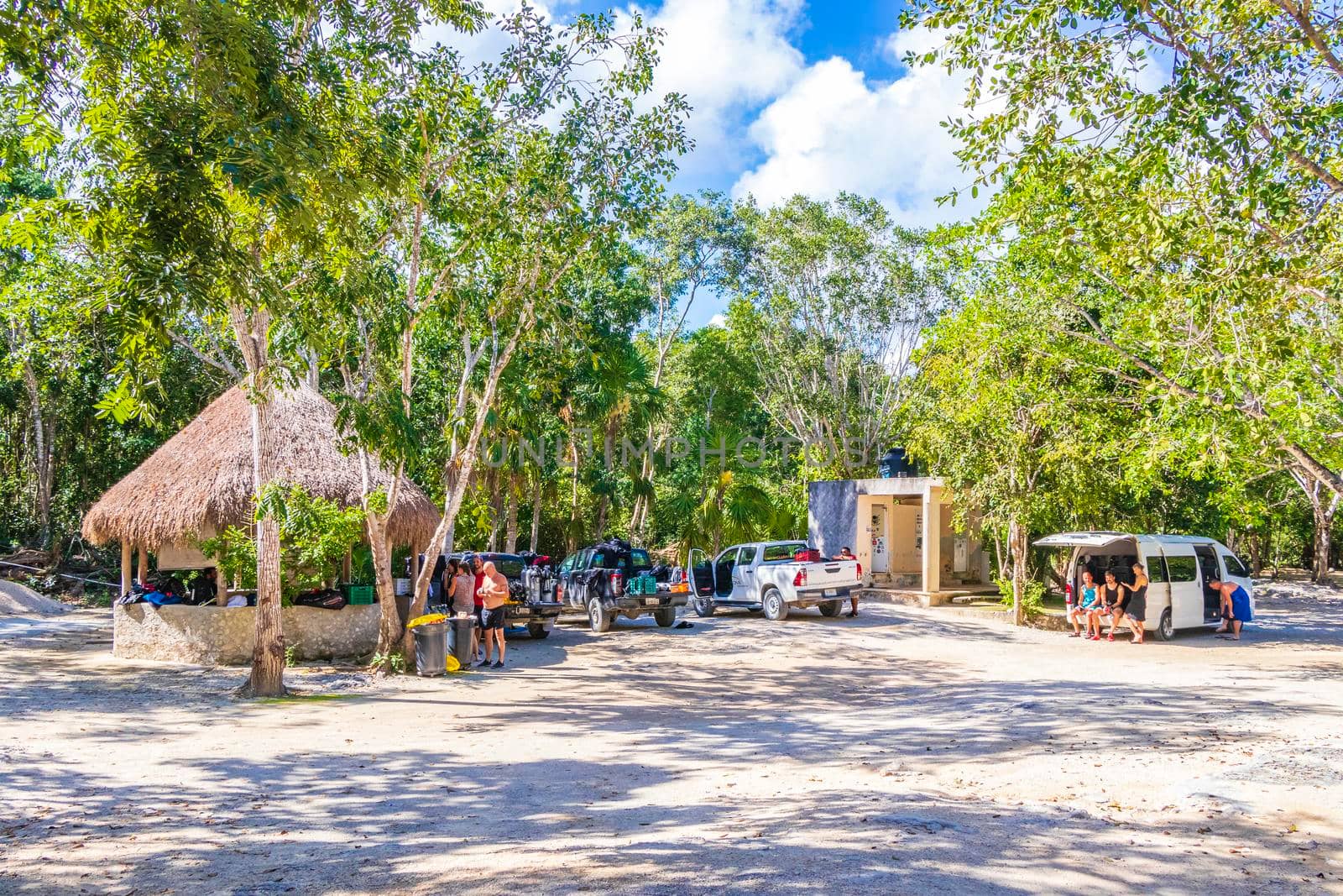 Quintana Roo Mexico 04. February 2022 Parking lot at the amazing blue turquoise water and limestone cave sinkhole cenote Tajma ha Tajmaha in Puerto Aventuras Quintana Roo Mexico.