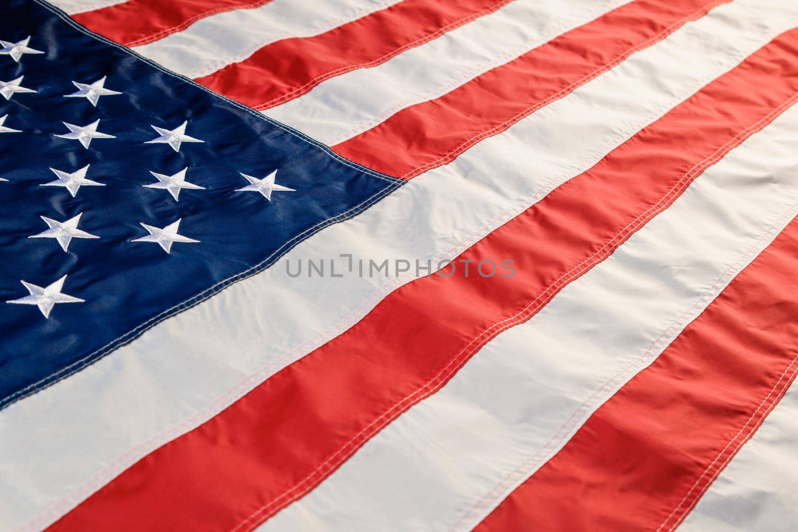 full-frame background of nylon sewed and embroided United States national flag - wide angle diagonal view