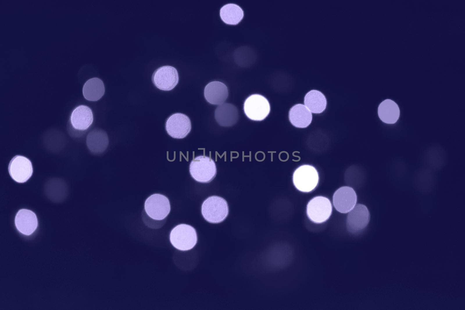 Classic blue lights bokeh background, Chrismas lights bokeh. Classic blue abstract background. Blurred and glowing lights. Classic blue bokeh lens effect from lighting spots. by kizuneko