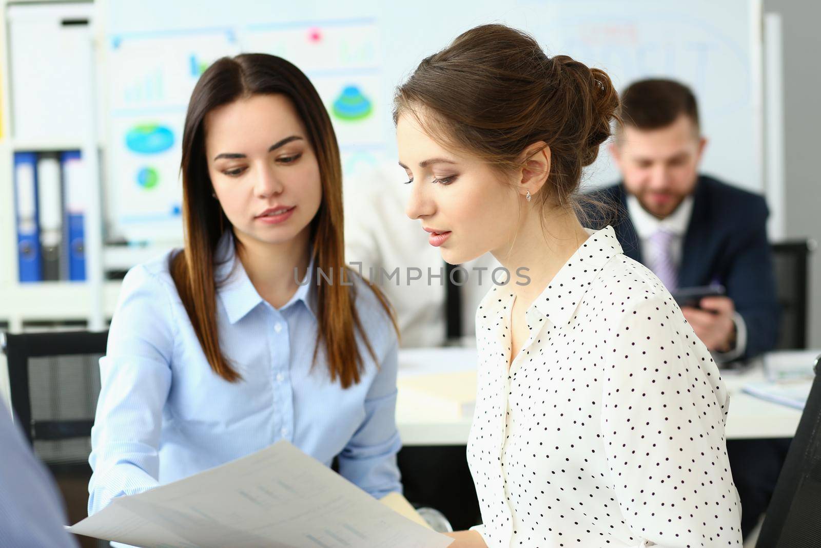 Businesswomen working together at company office, teamwork and teambuilding by kuprevich