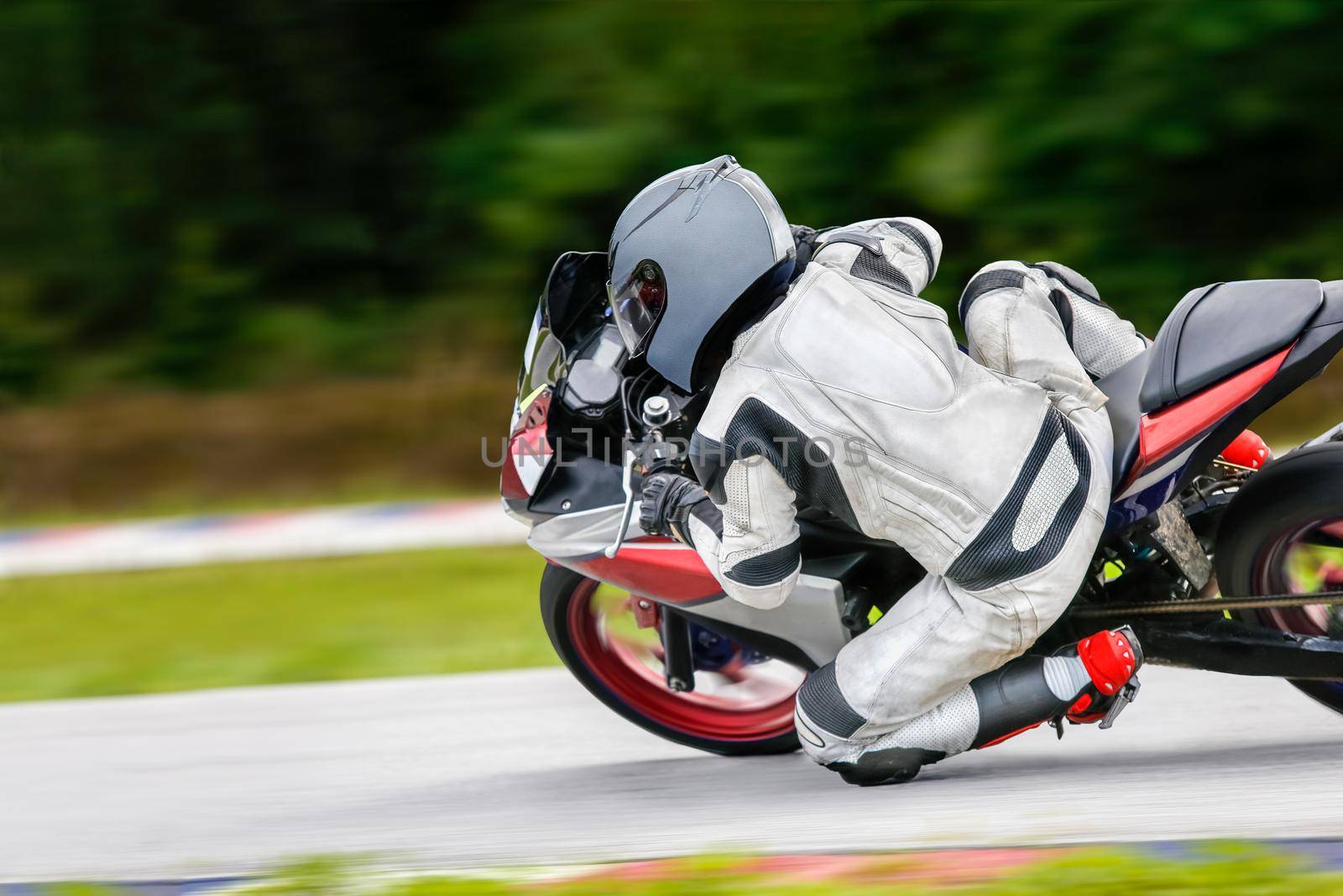 Motorcycle practice leaning into a fast corner on track by toa55