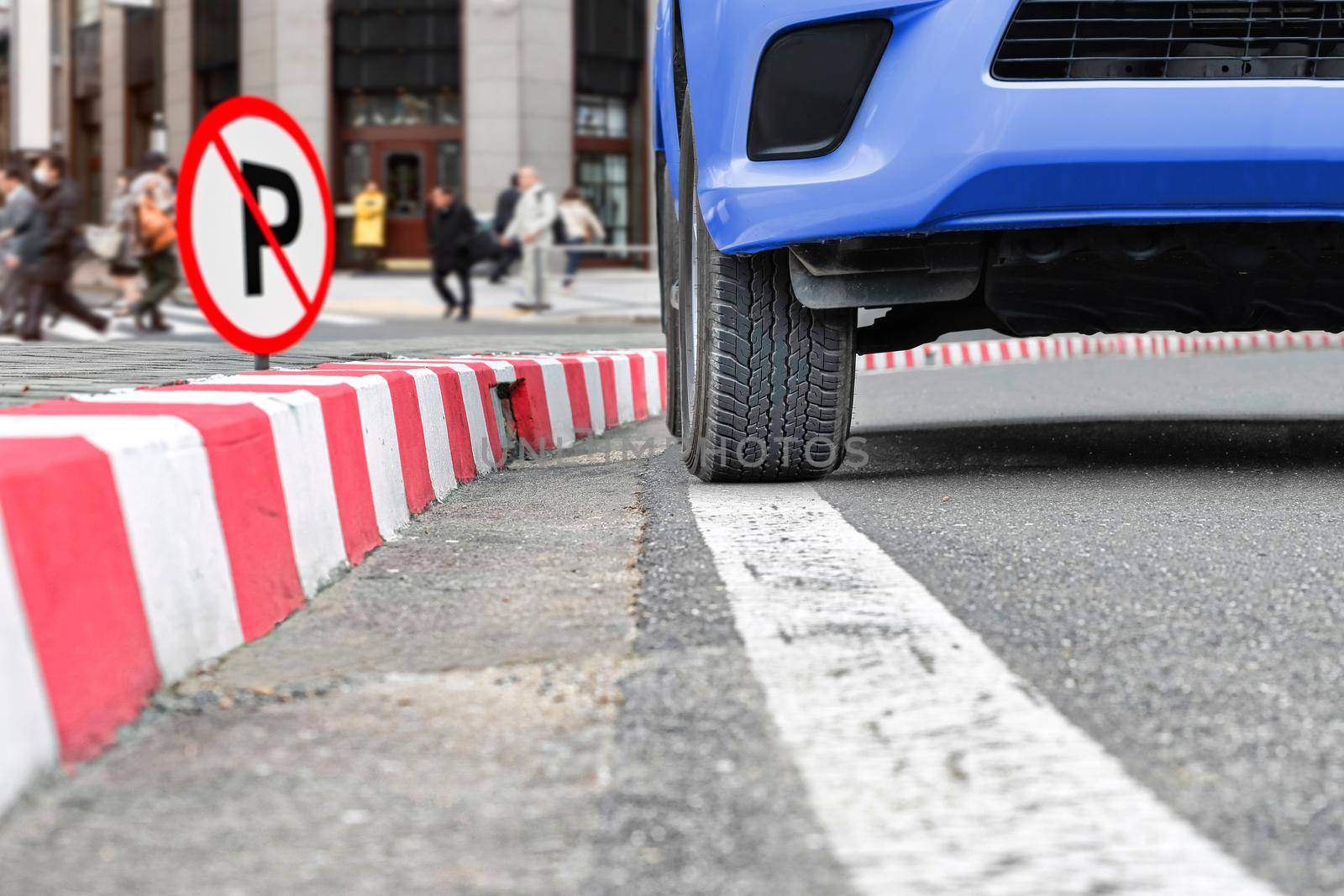 No parking sign at red stripes sign on street by toa55