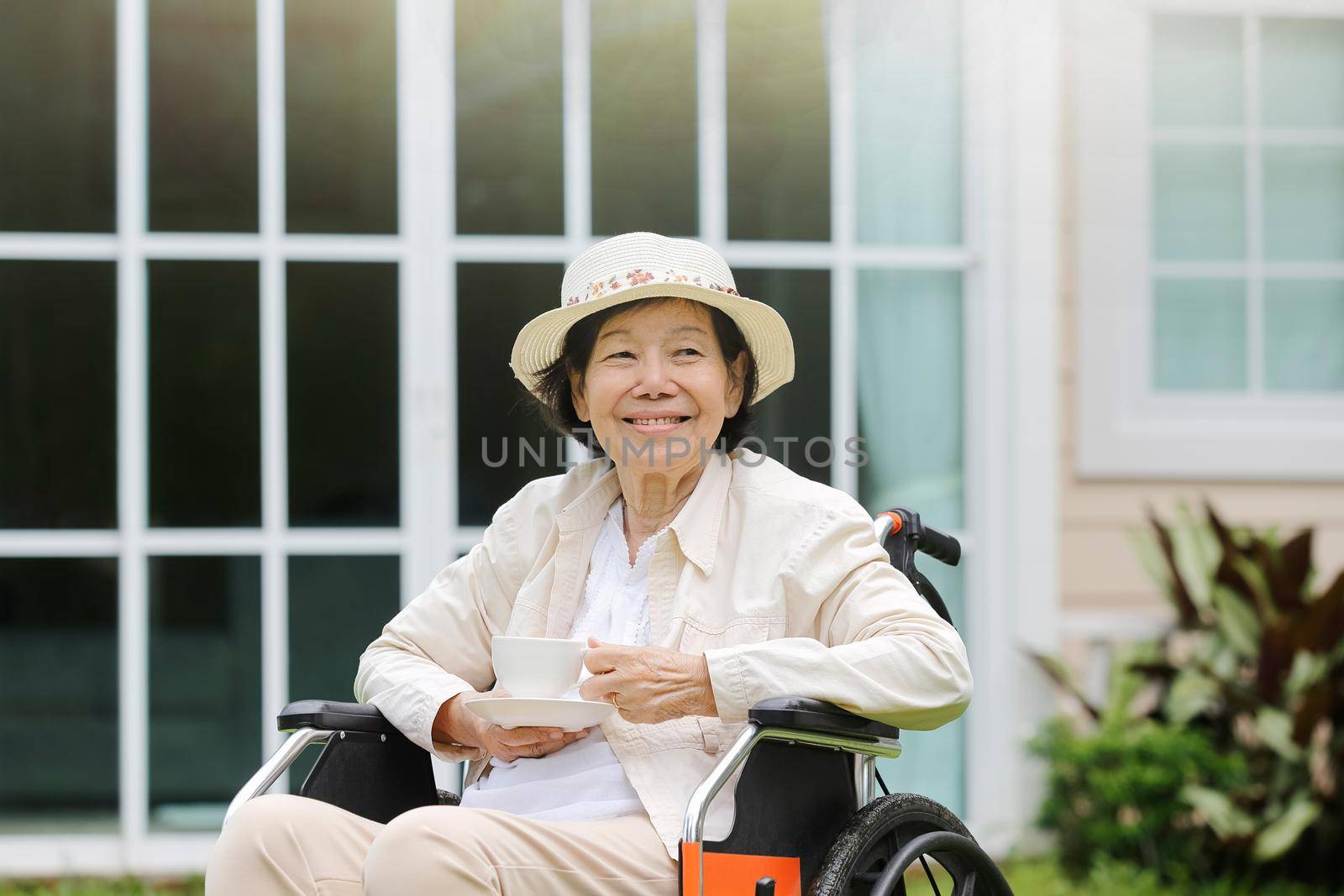 elderly woman relax in backyard by toa55