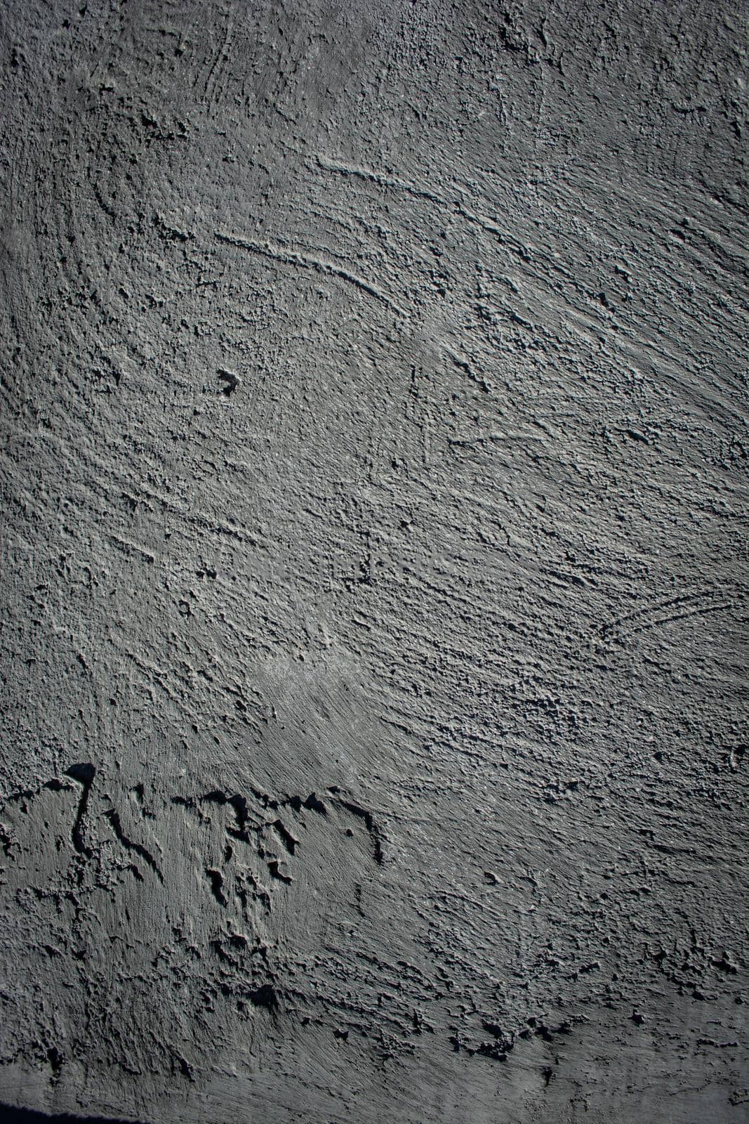 Vertical background from concrete. Gray back. Scratches and blemishes on plaster.