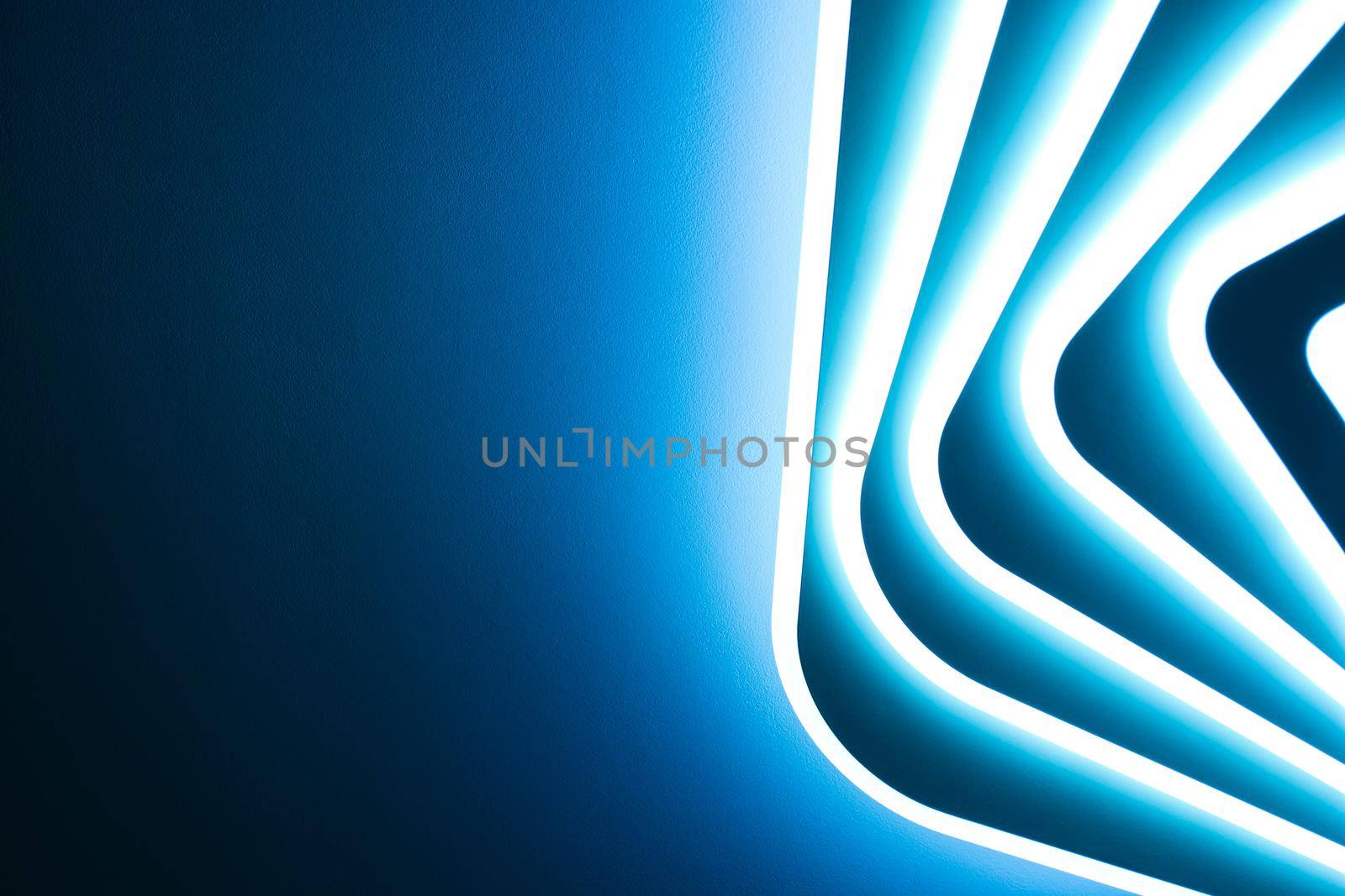 Abstraction, banner background. Blue bright light from a multi-level LED lamp.