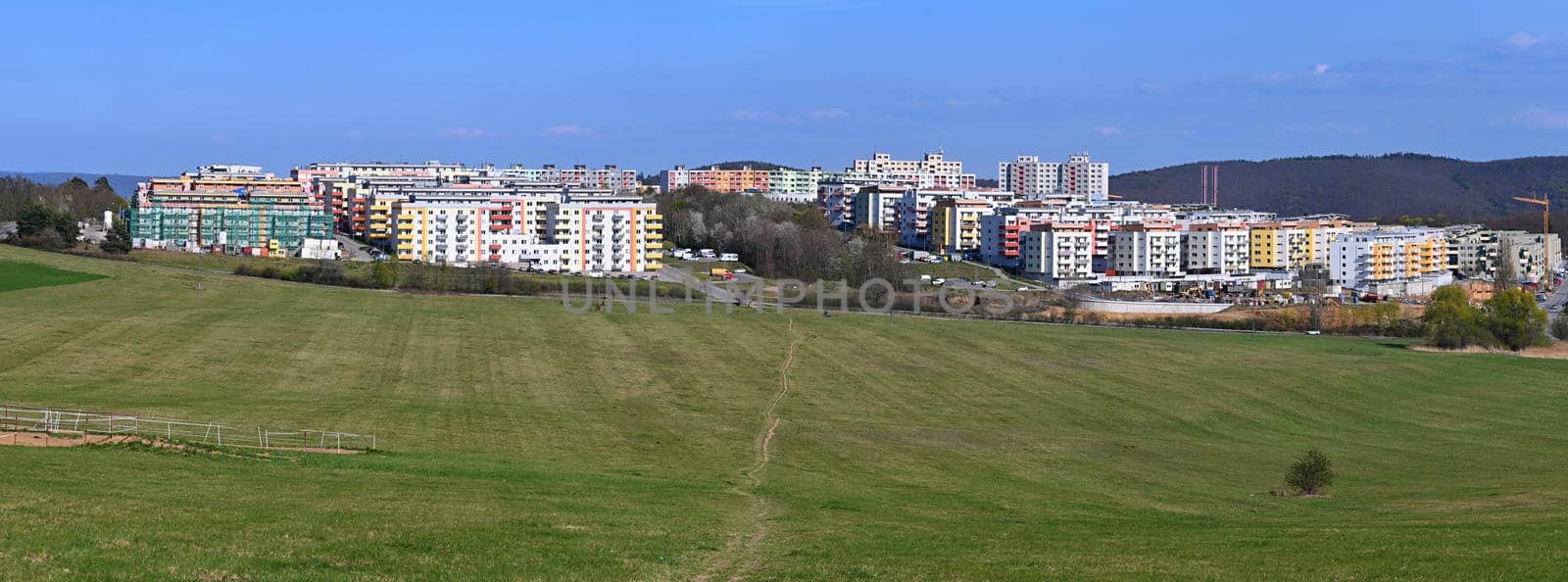 Construction of new apartment buildings in the housing estate. Concept for housing and construction of new apartments. Rising building materials and rising real estate prices. by Montypeter