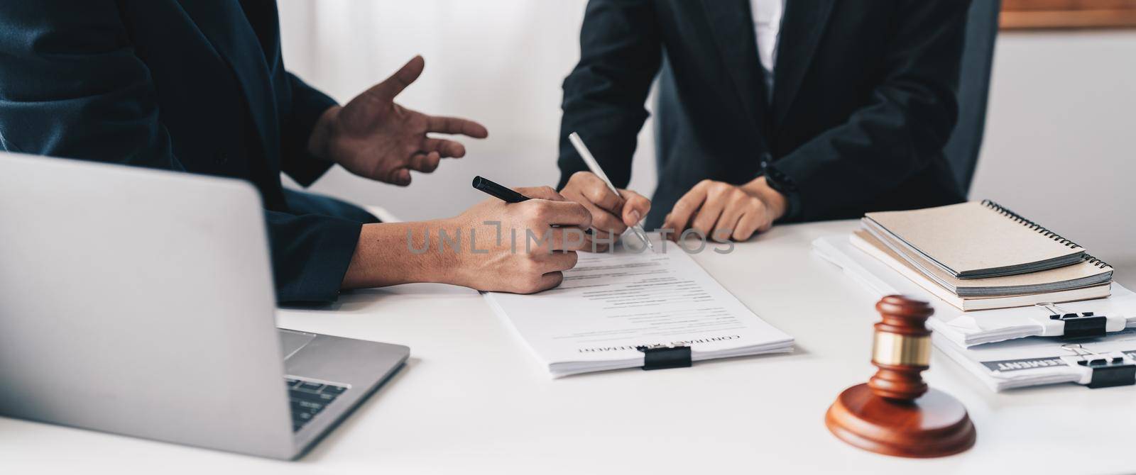 Businessman and lawyer discuss the contract document. Treaty of the law. Sign a contract business.