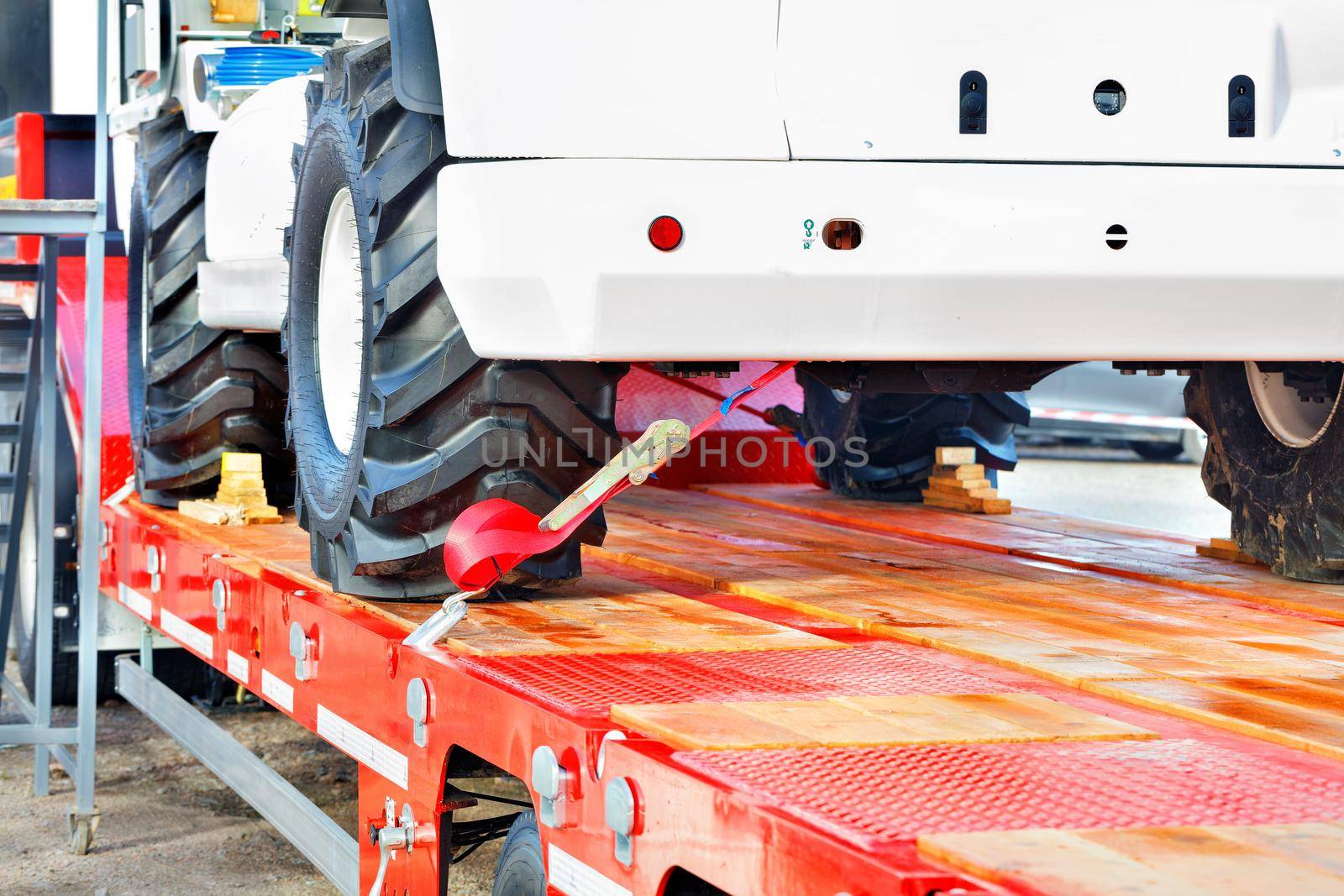 Securing heavy loads with a lashing strap on the transport platform, copy space.