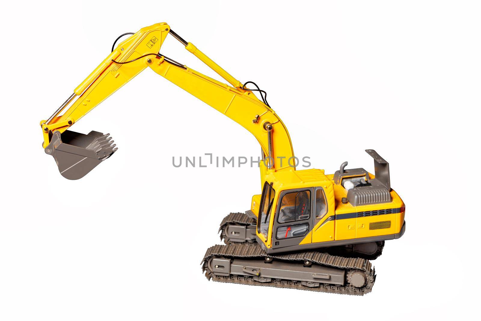 Toy model of a construction excavator isolated on a white background. by Sergii