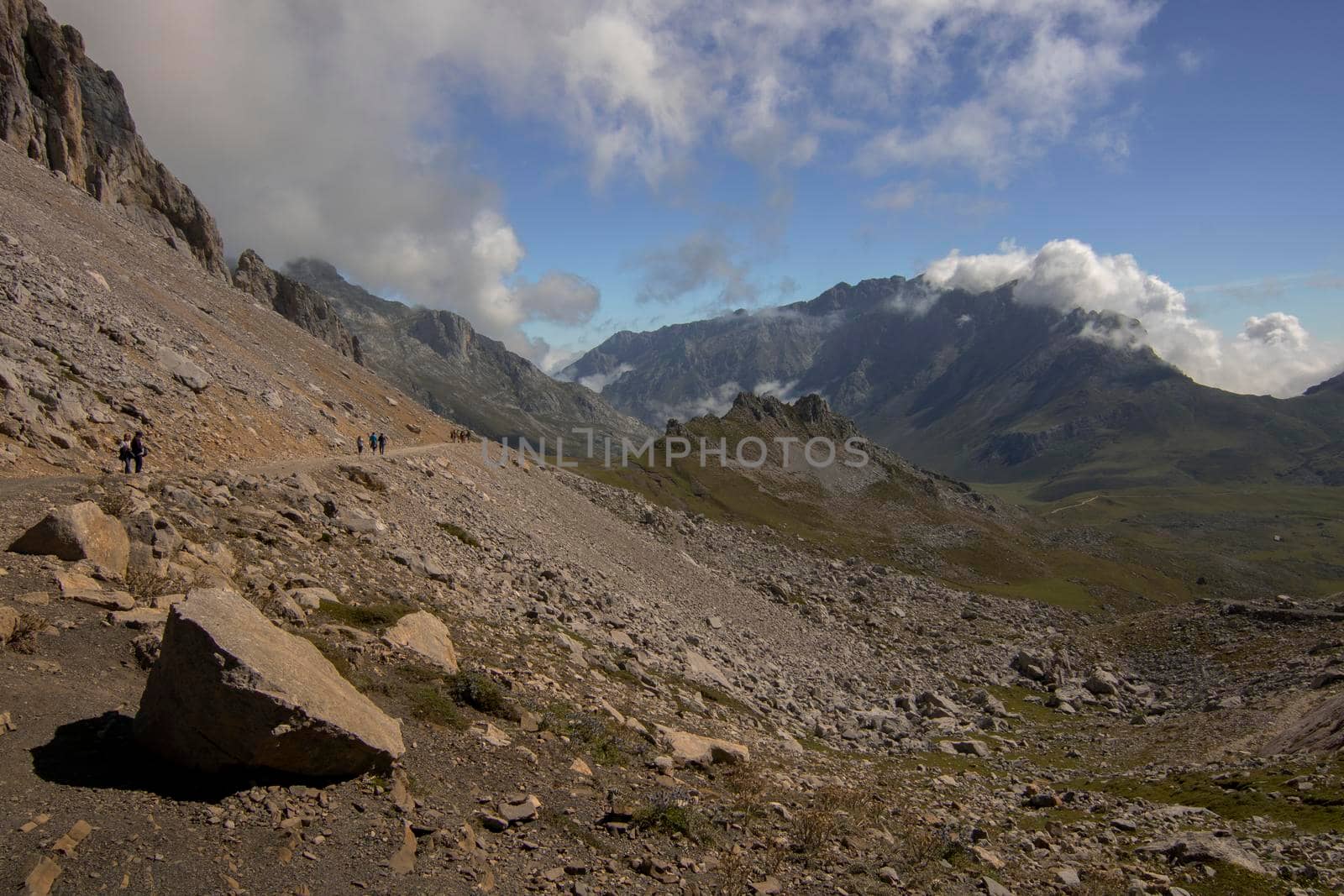 Landscape showing rocks and some mountains under some clouds in Fuente De in Spain