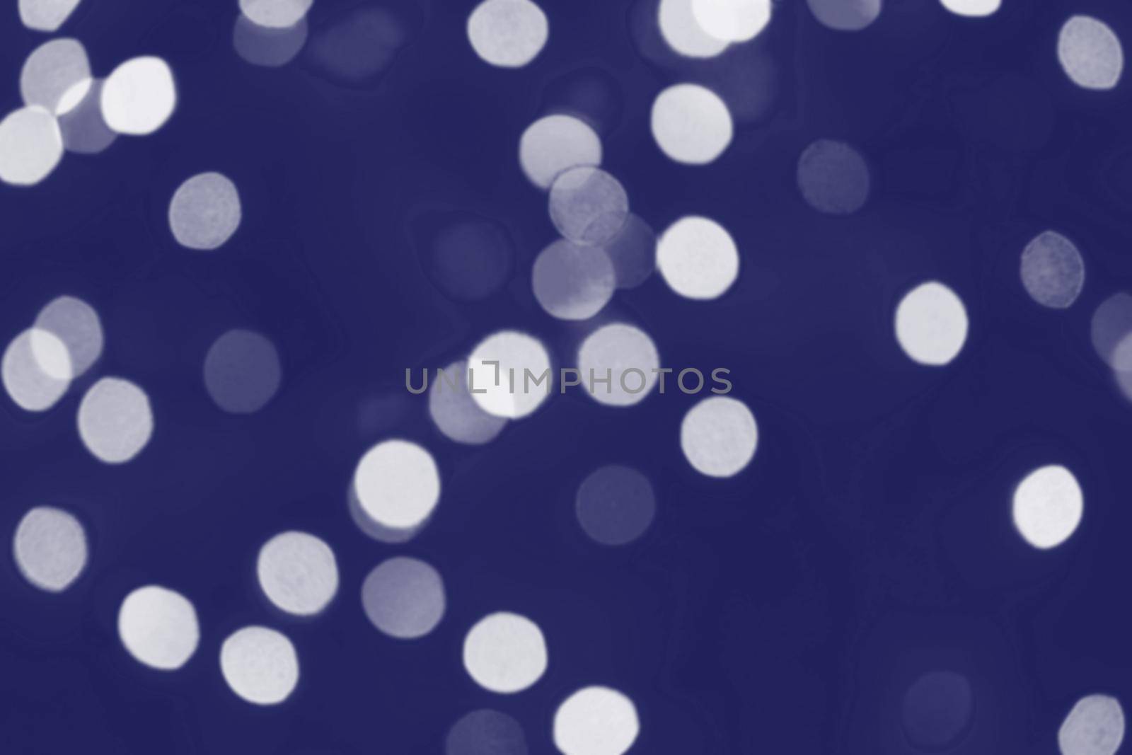 Classic blue lights bokeh background, Chrismas lights bokeh. Classic blue abstract background. Blurred and glowing lights. Classic blue bokeh lens effect from lighting spots. by kizuneko